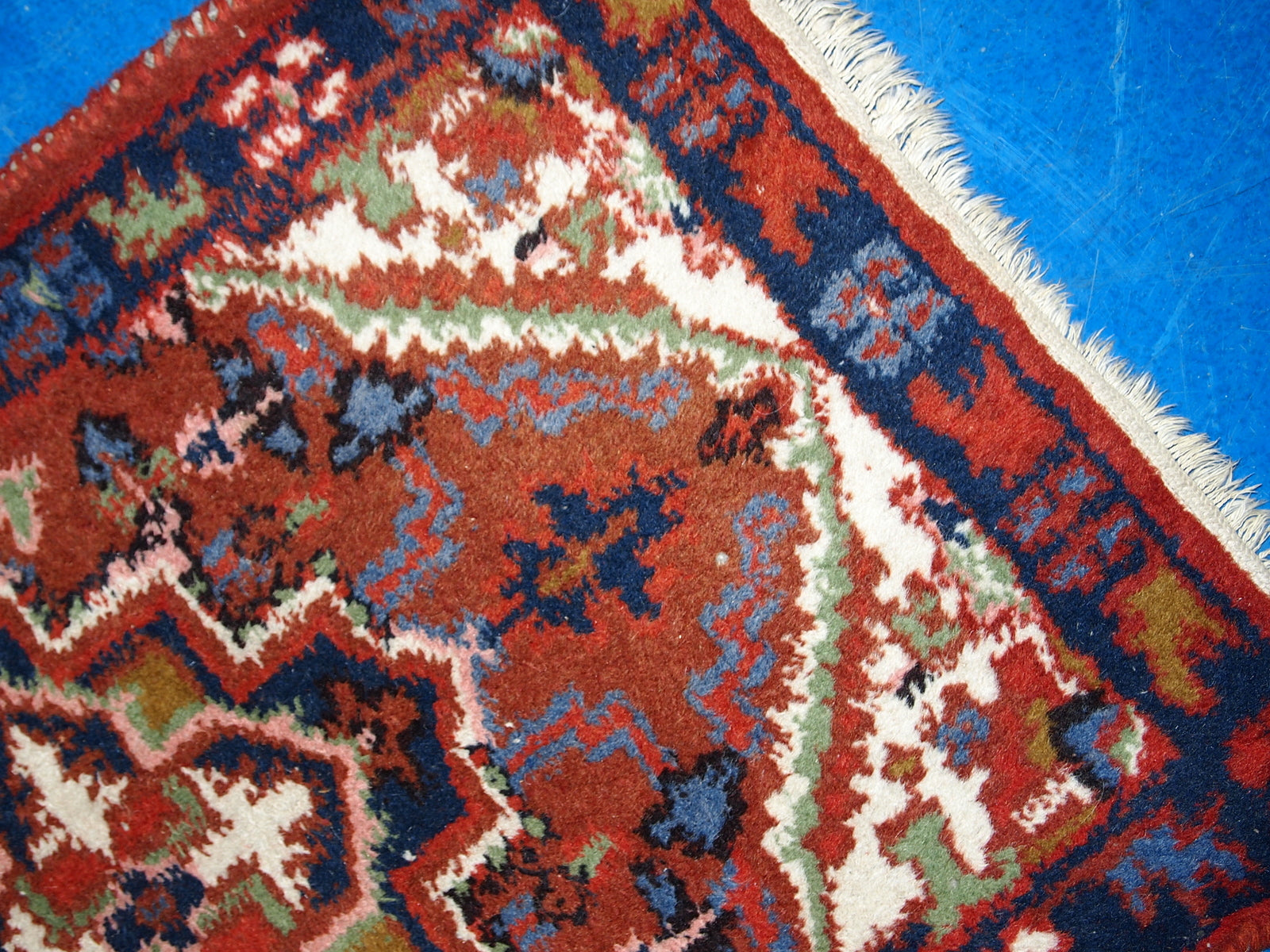 Vintage handmade Middle Eastern Hamadan mat in original good condition. The rug is from the end of 20th century in brick red colour.
