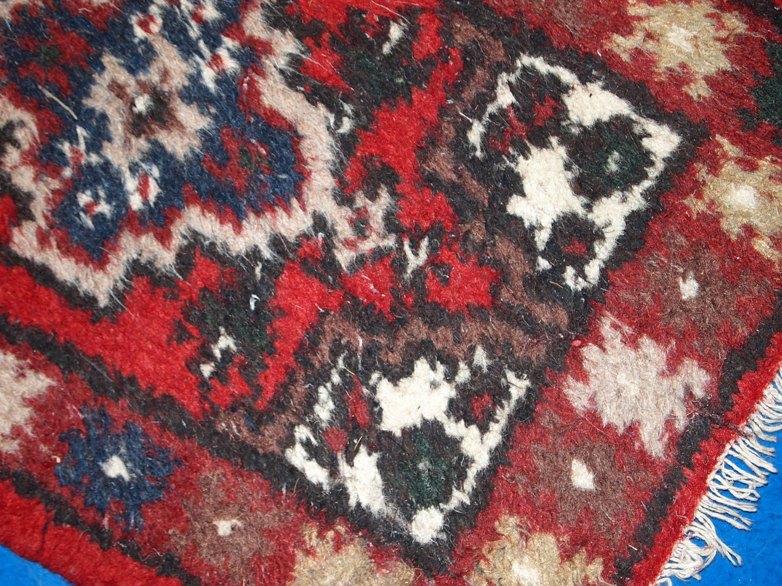 Vintage handmade Middle Eastern mat in original good condition. The rug is from the end of 20th century.