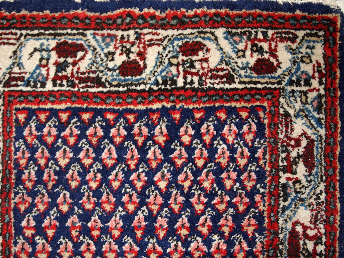 Handmade vintage Indian rug with Middle Eastern Seraband design. The rug is made in the end of 20th century, it is in original good condition.