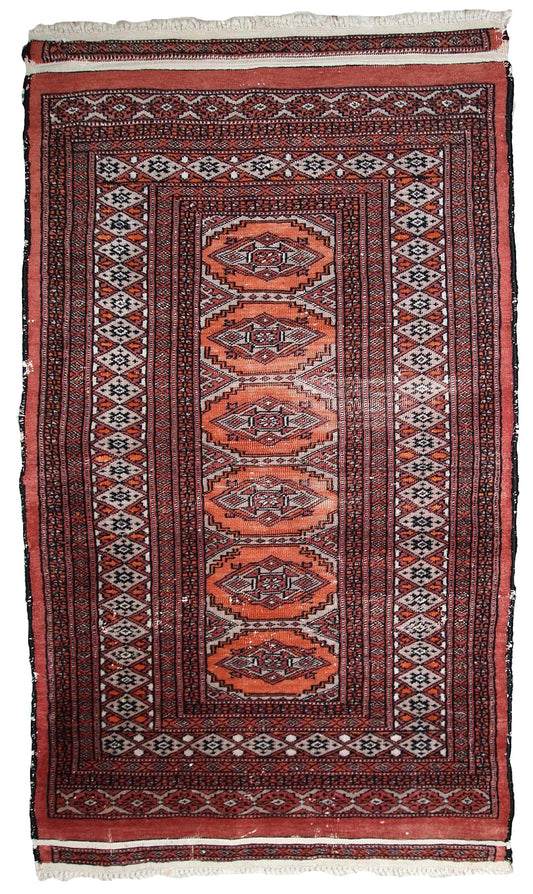 Handmade vintage Uzbek Bukhara distressed rug 1960s