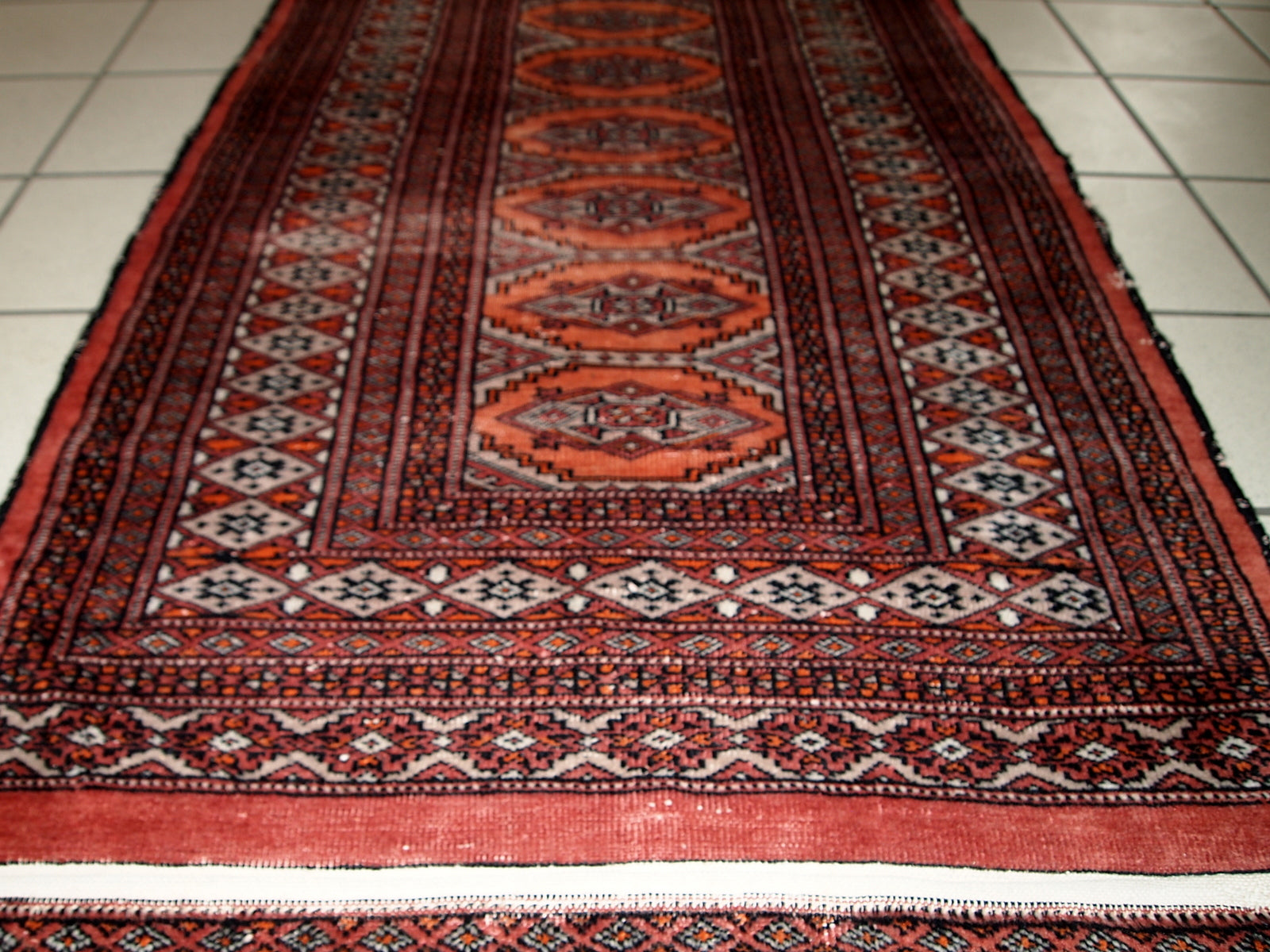 Handmade vintage Uzbek Bukhara distressed rug 1960s