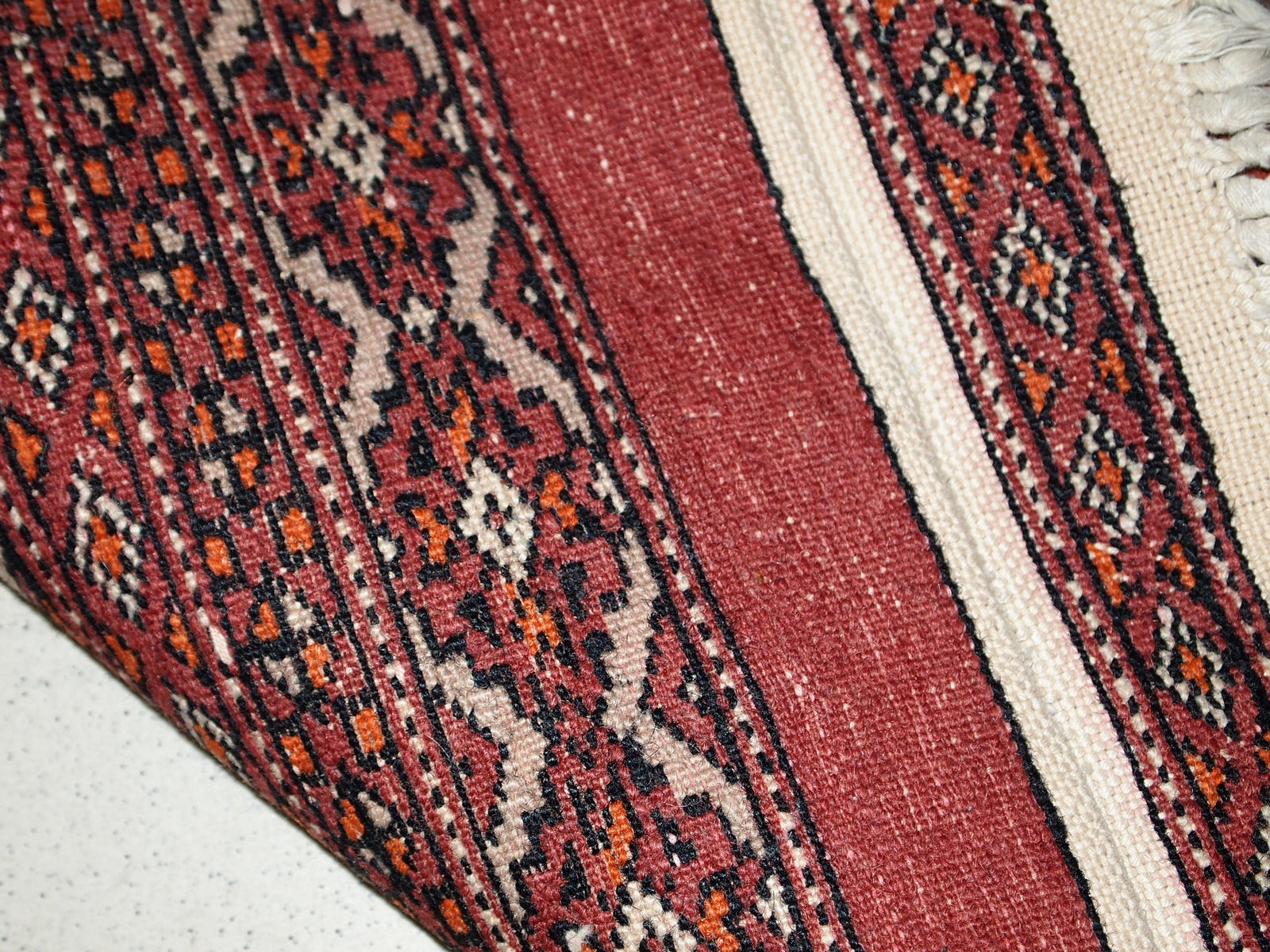 Handmade vintage Uzbek Bukhara distressed rug 1960s