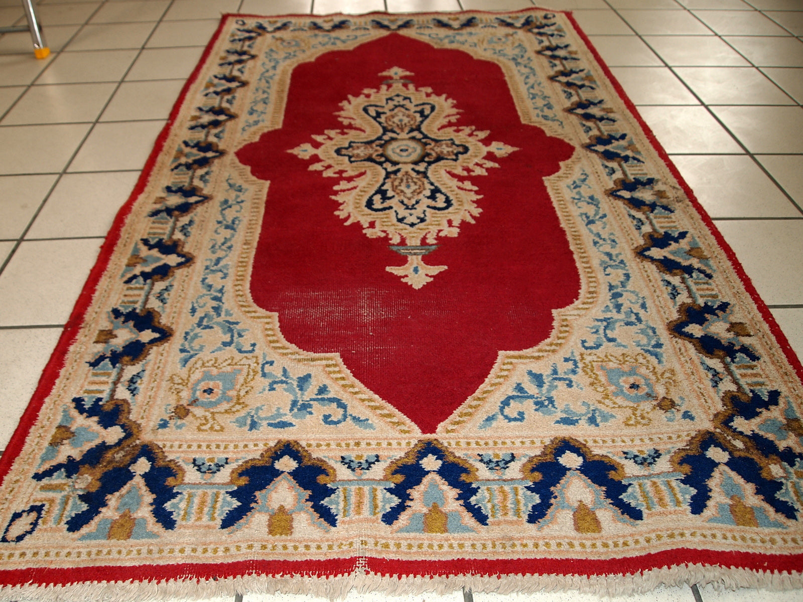Handmade vintage Middle Eastern rug in traditional design. The rug is from the end of 20th century in original condition, it as some low pile. 