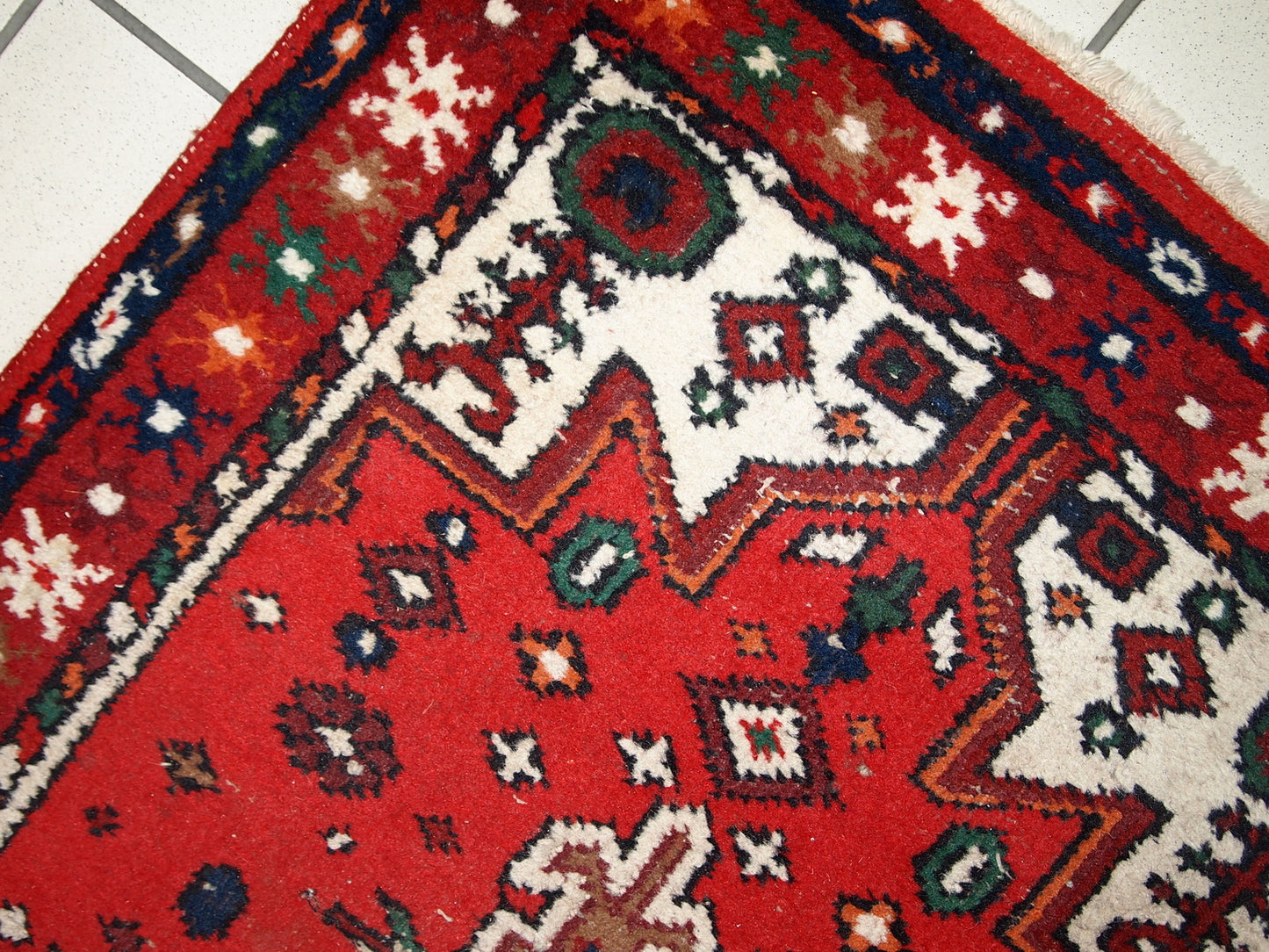 Handmade vintage Middle Eastern rug in traditional design. The rug is from the end of 20th century in original good condition. 