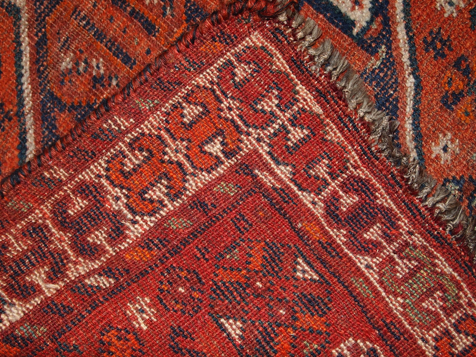 Handmade antique Persian Shiraz distressed rug 1900s
