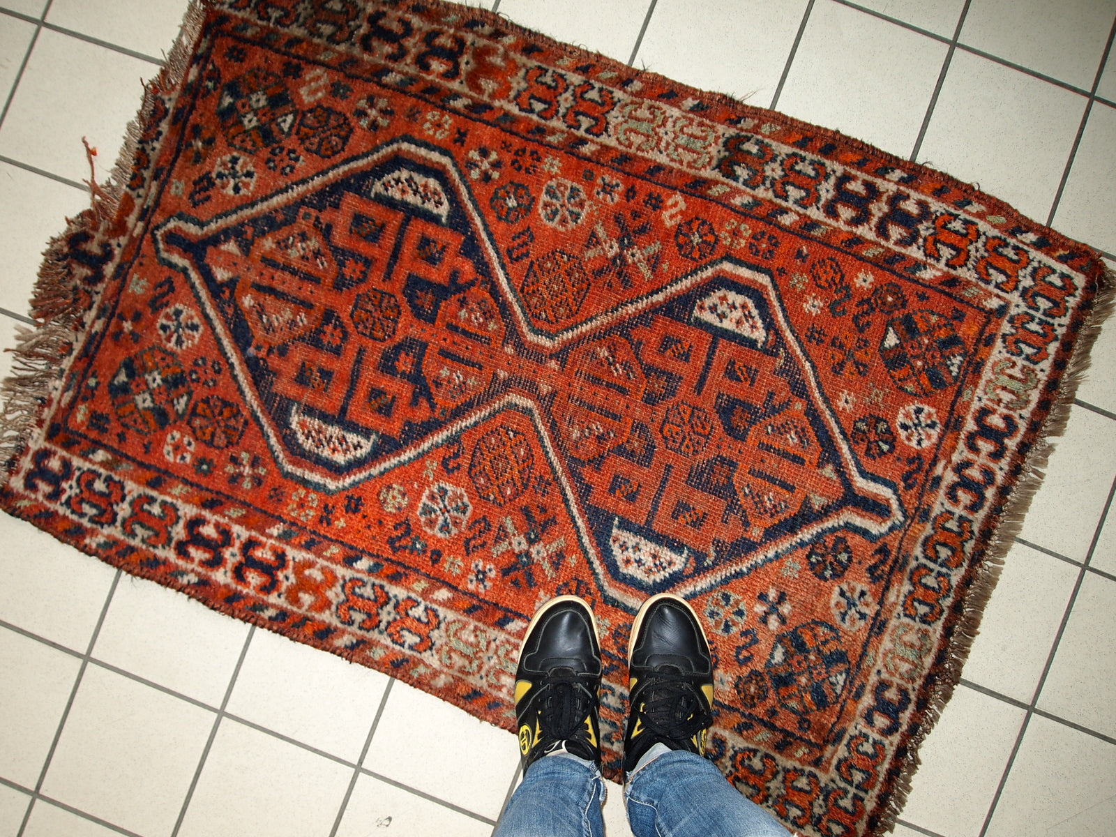 Handmade antique Persian Shiraz distressed rug 1900s
