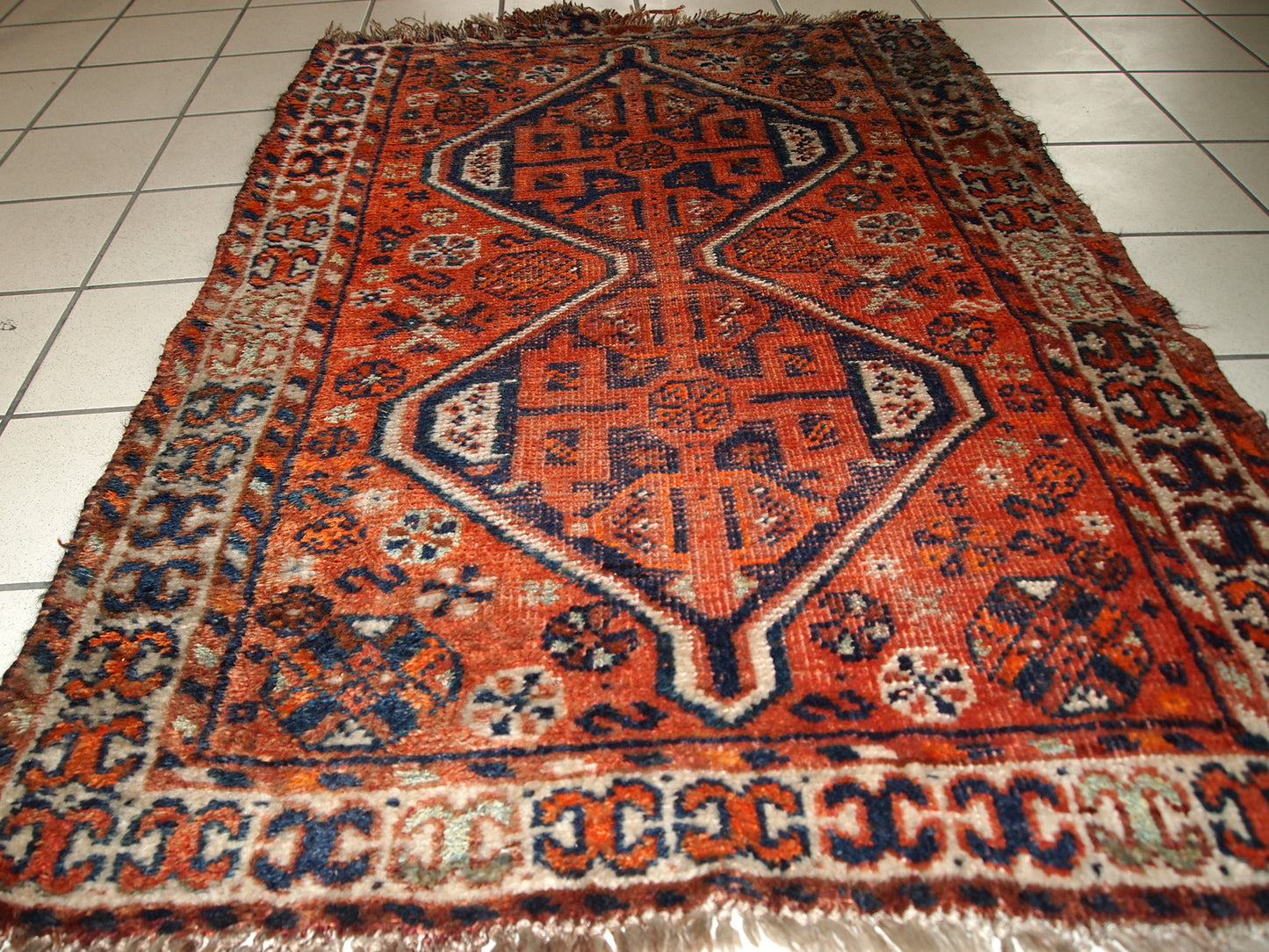 Handmade antique Persian Shiraz distressed rug 1900s