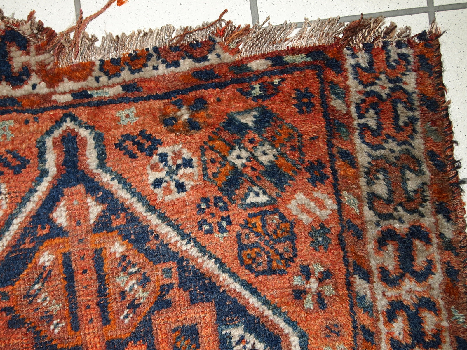 Handmade antique Persian Shiraz distressed rug 1900s