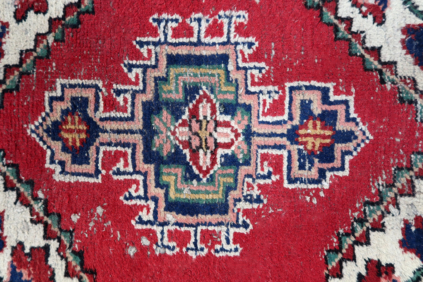 Handmade vintage Persian Hamadan rug in distressed condition. The rug has been made in wool in the end of 20th century.