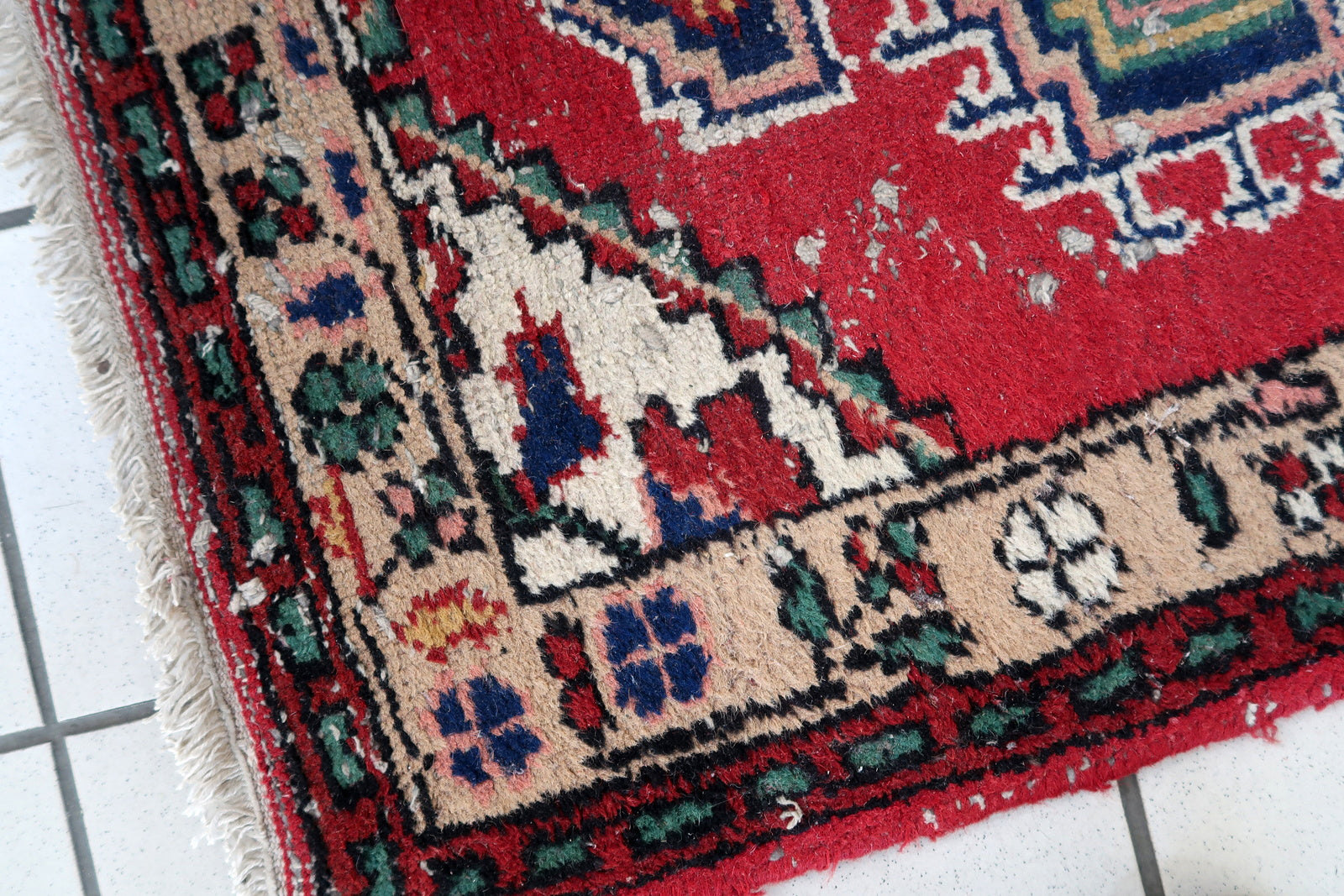 Handmade vintage Persian Hamadan rug in distressed condition. The rug has been made in wool in the end of 20th century.