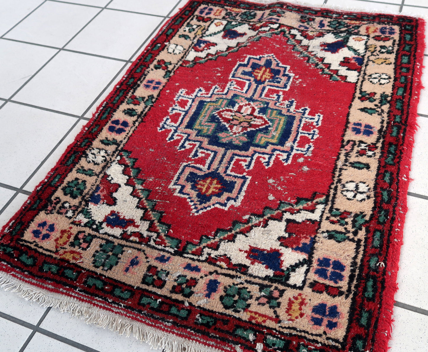 Handmade vintage Persian Hamadan rug in distressed condition. The rug has been made in wool in the end of 20th century.