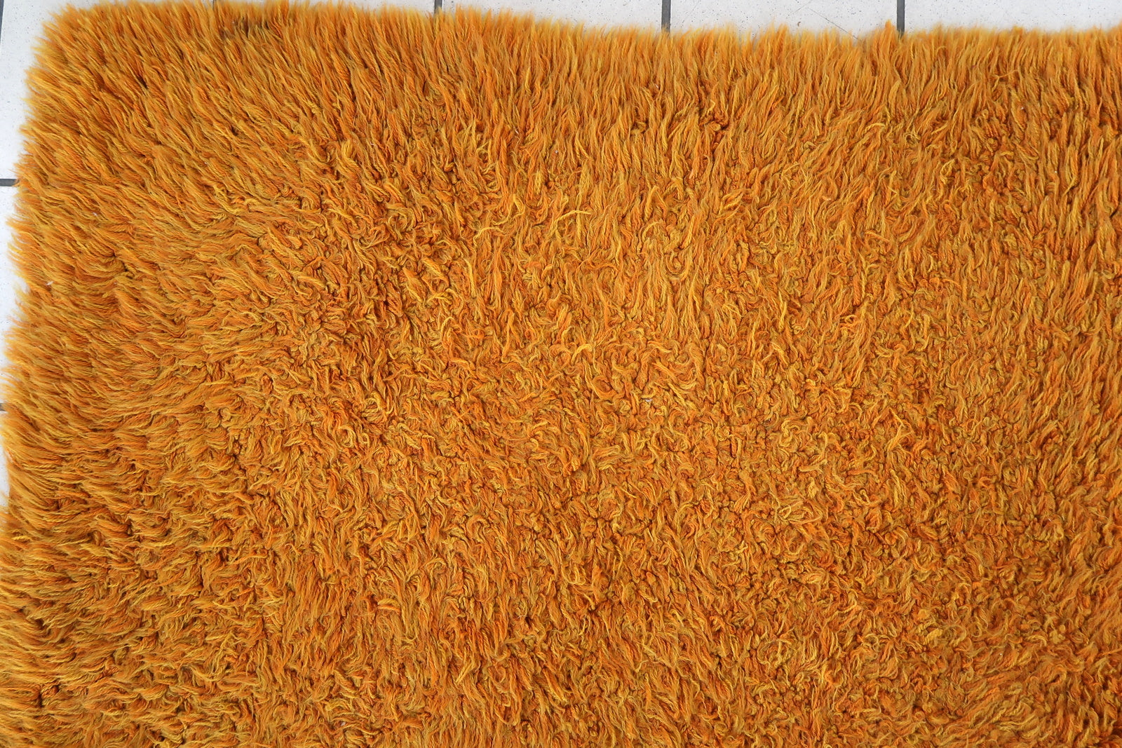 Handmade vintage Swedish Shag rug in original good condition. The rug is from the end of 20th century made in orange wool