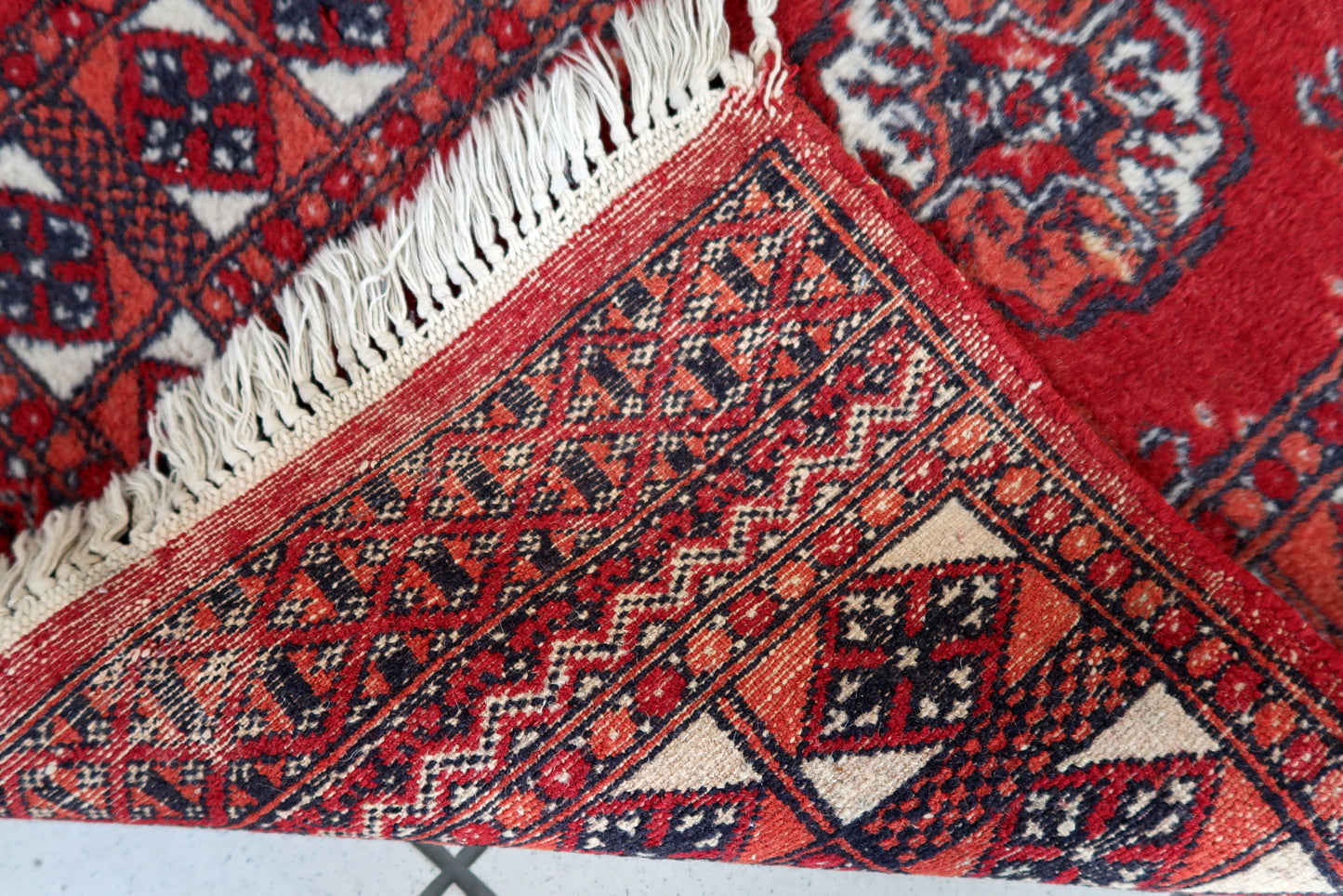 Handmade vintage Afghan Ersari rug in original good condition. The rug has been made in wool in the end of 20th century.