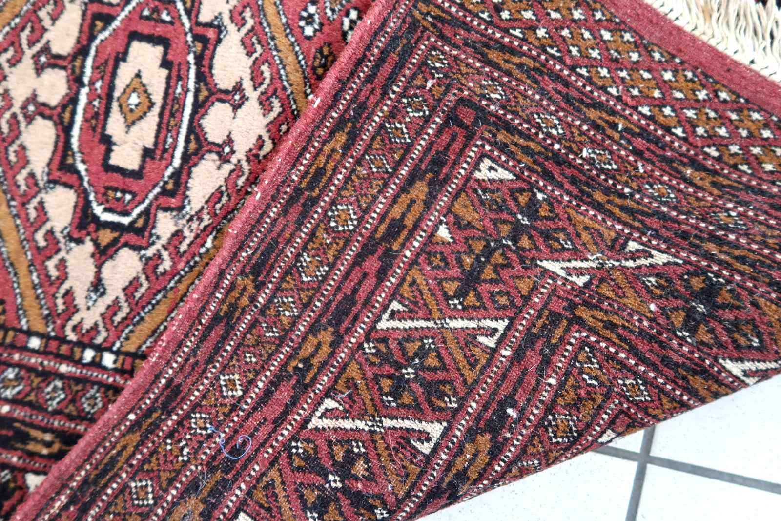 Handmade vintage Afghan Ersari rug in original good condition. The rug has been made in wool in the end of 20th century.