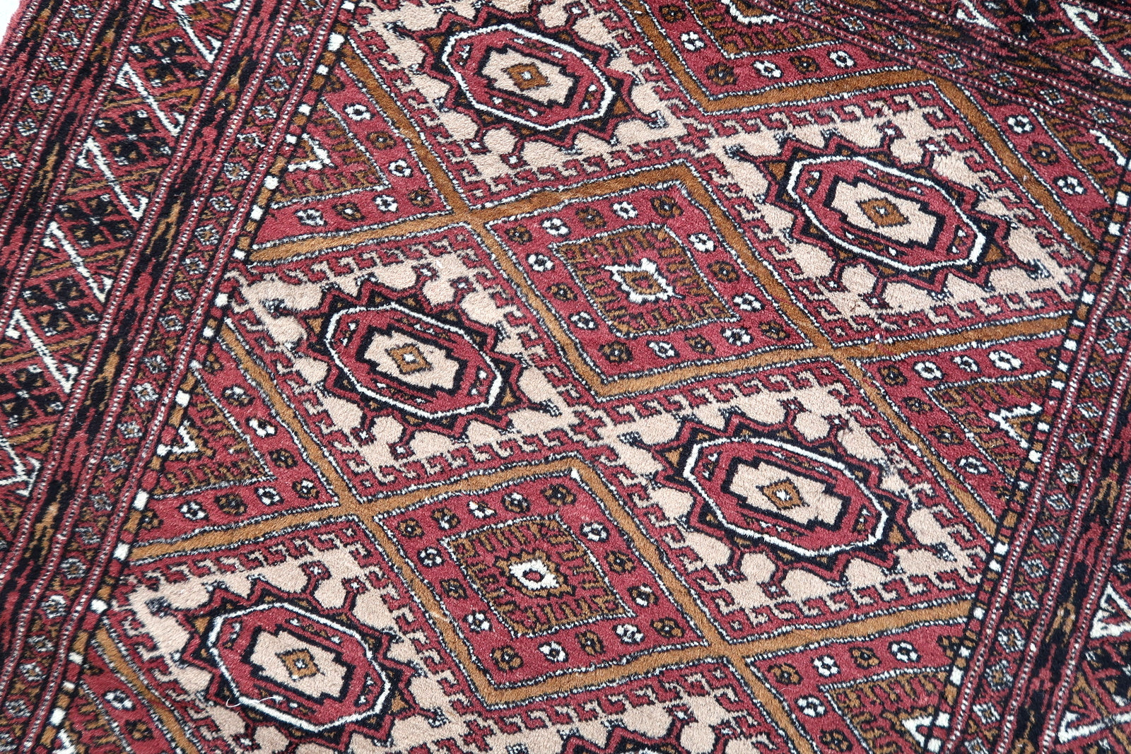 Handmade vintage Afghan Ersari rug in original good condition. The rug has been made in wool in the end of 20th century.