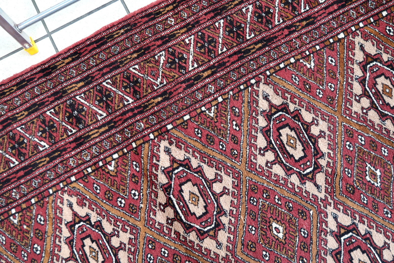Handmade vintage Afghan Ersari rug in original good condition. The rug has been made in wool in the end of 20th century.