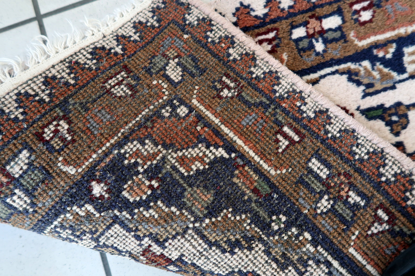 Handmade vintage Middle Eastern mat in light colors. The rug is from the end of 20th century in original good condition.
