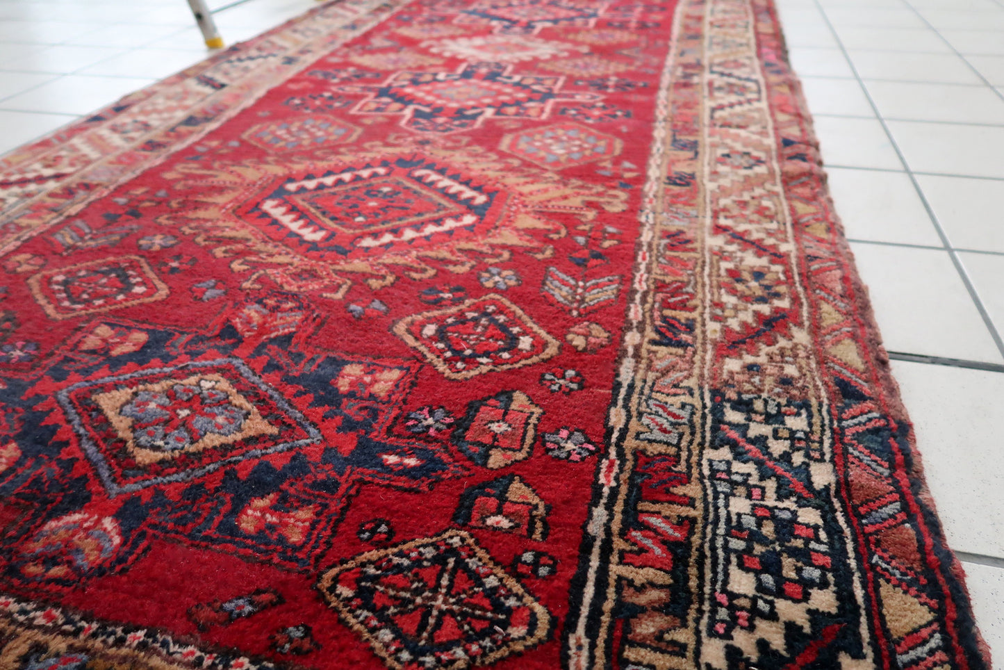 Handmade vintage Persian Malayer runner in original condition, it has some signs of age and low pile. The rug has been made in wool in the end of 20th century.