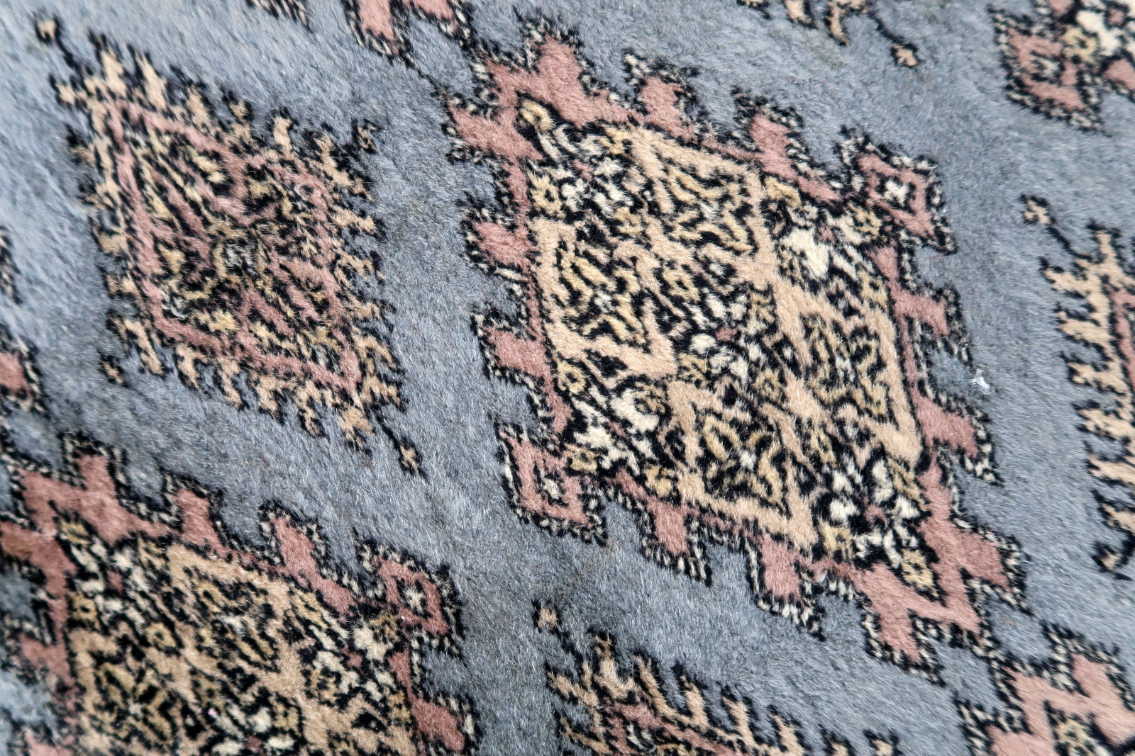 Handmade vintage Uzbek Bukhara runner in traditional design. The rug is from the end of 20th century made in wool.