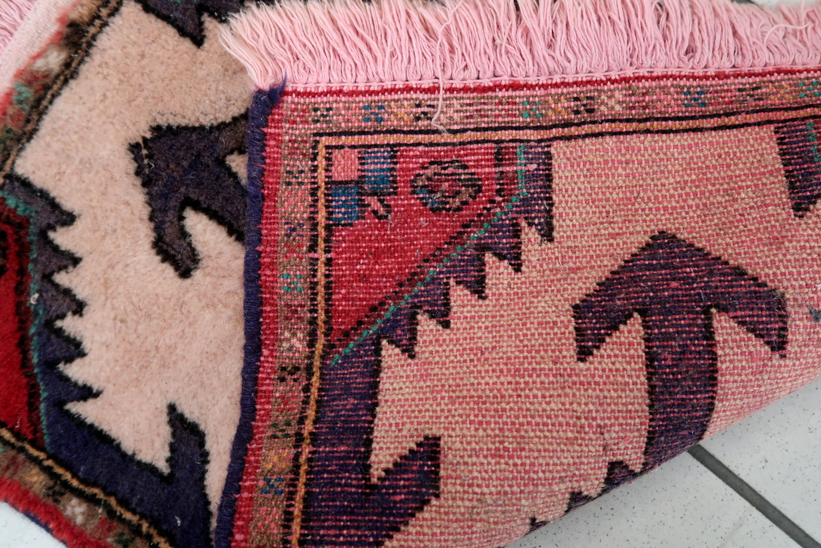 Handmade vintage Middle Eastern rug in traditional medallion design. The rug has been made in wool in the end of 20th century. It is in original good condition