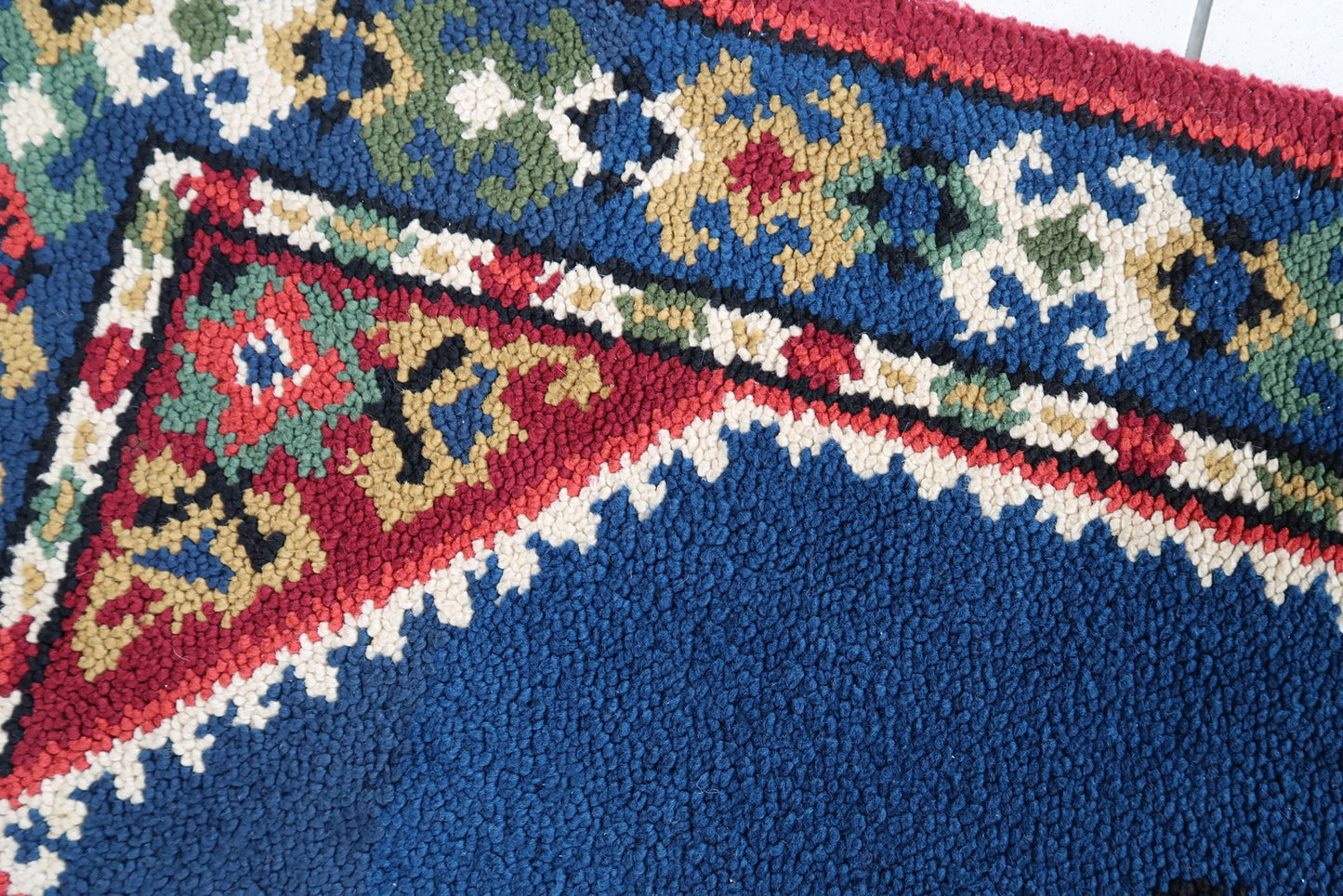 Vintage French Savonnerie rug in blue and red colors. The rug has been made in wool in the end of 20th century. It is in original good condition.