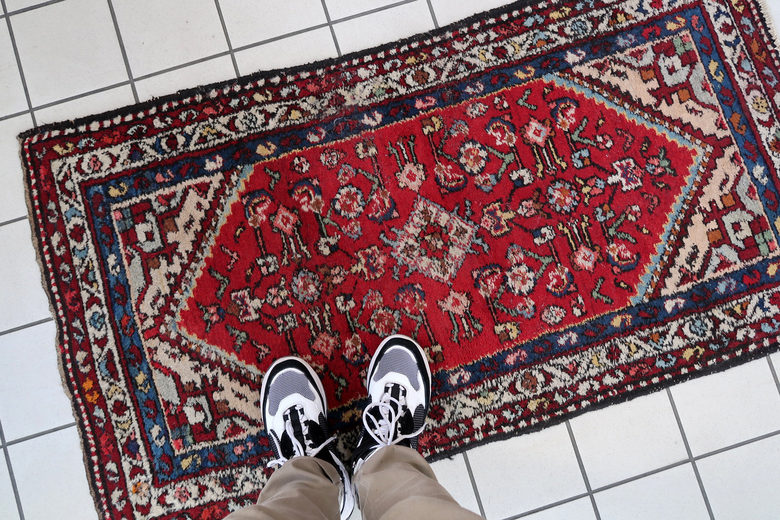 Handmade vintage Persian Malayer rug in red color. The rug has been made in wool in the middle of 20th century. It is in original condition, it has some signs of age.