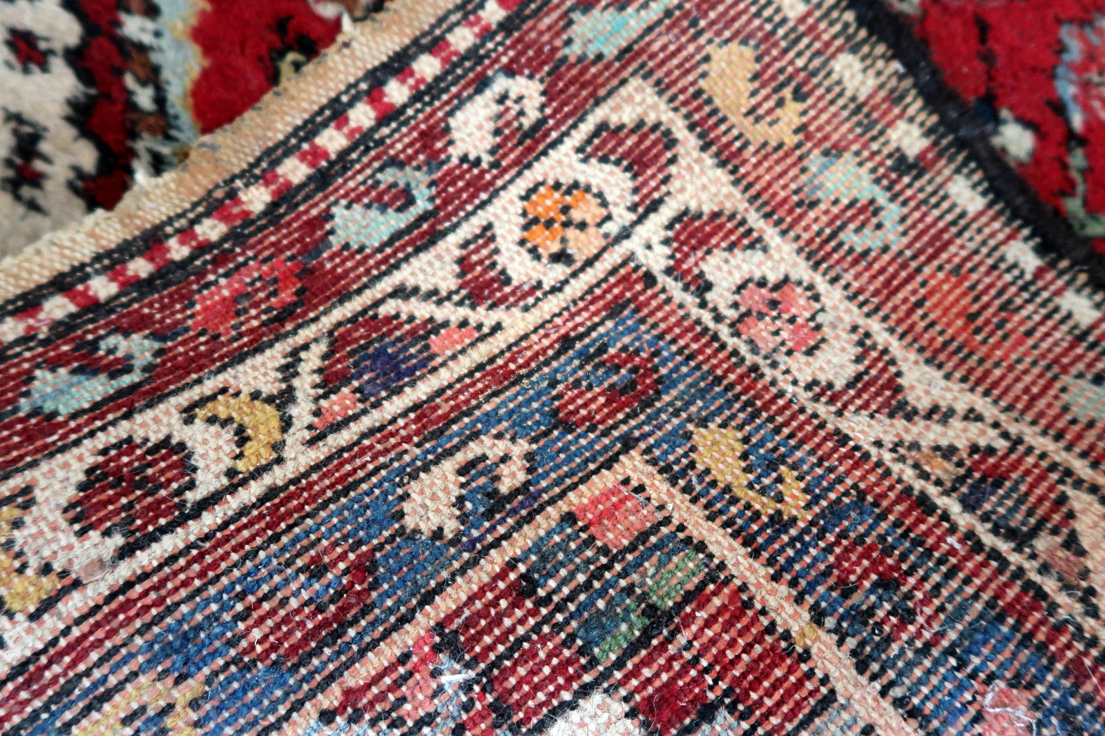 Handmade vintage Persian Malayer rug in red color. The rug has been made in wool in the middle of 20th century. It is in original condition, it has some signs of age.