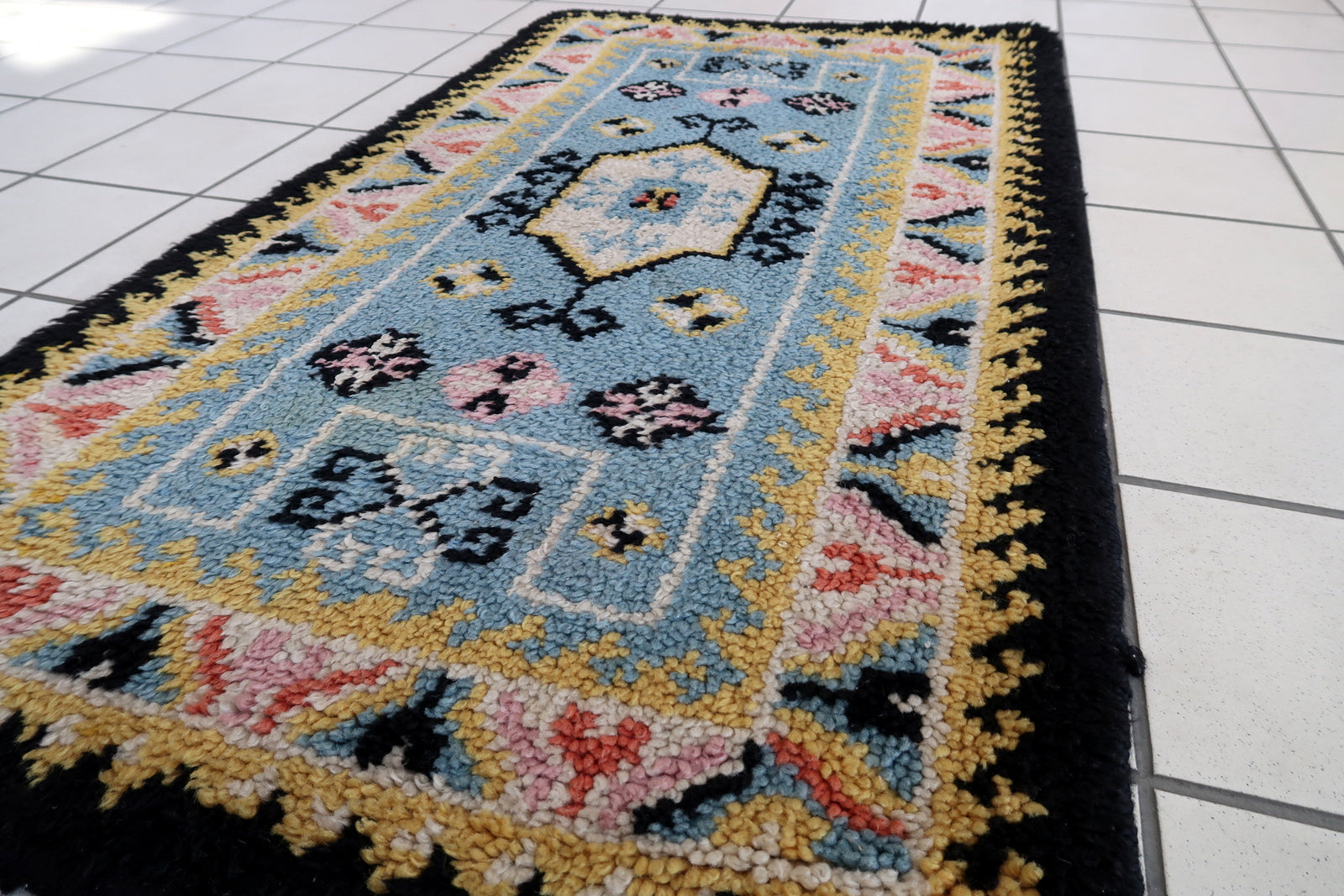Vintage French Savonnerie rug in sky blue color. The rug has been made in wool in the end of 20th century. It is in original good condition.