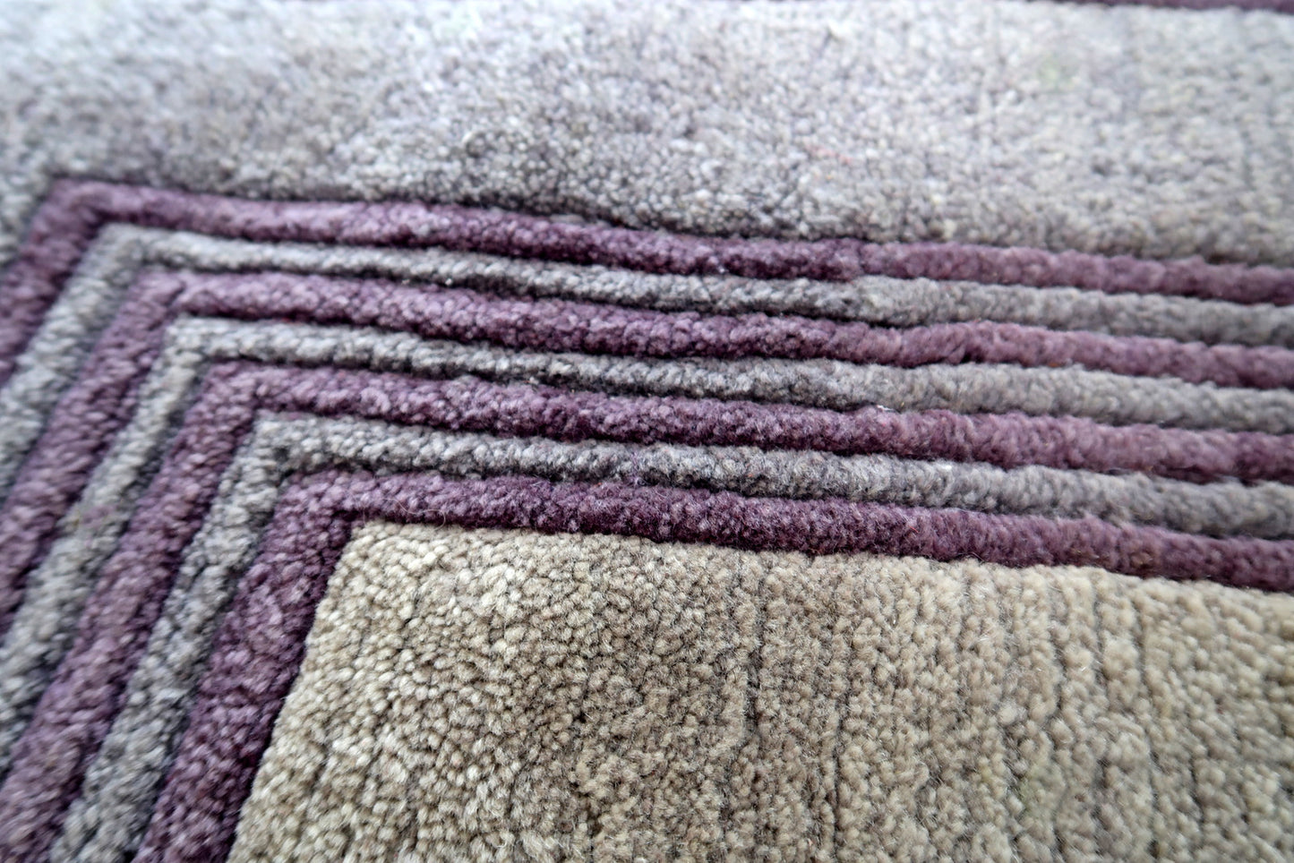 Handmade vintage Tibetan Khaden rug in geometric design. The rug has been made in wool in the end of 20th century. It is in original good condition.