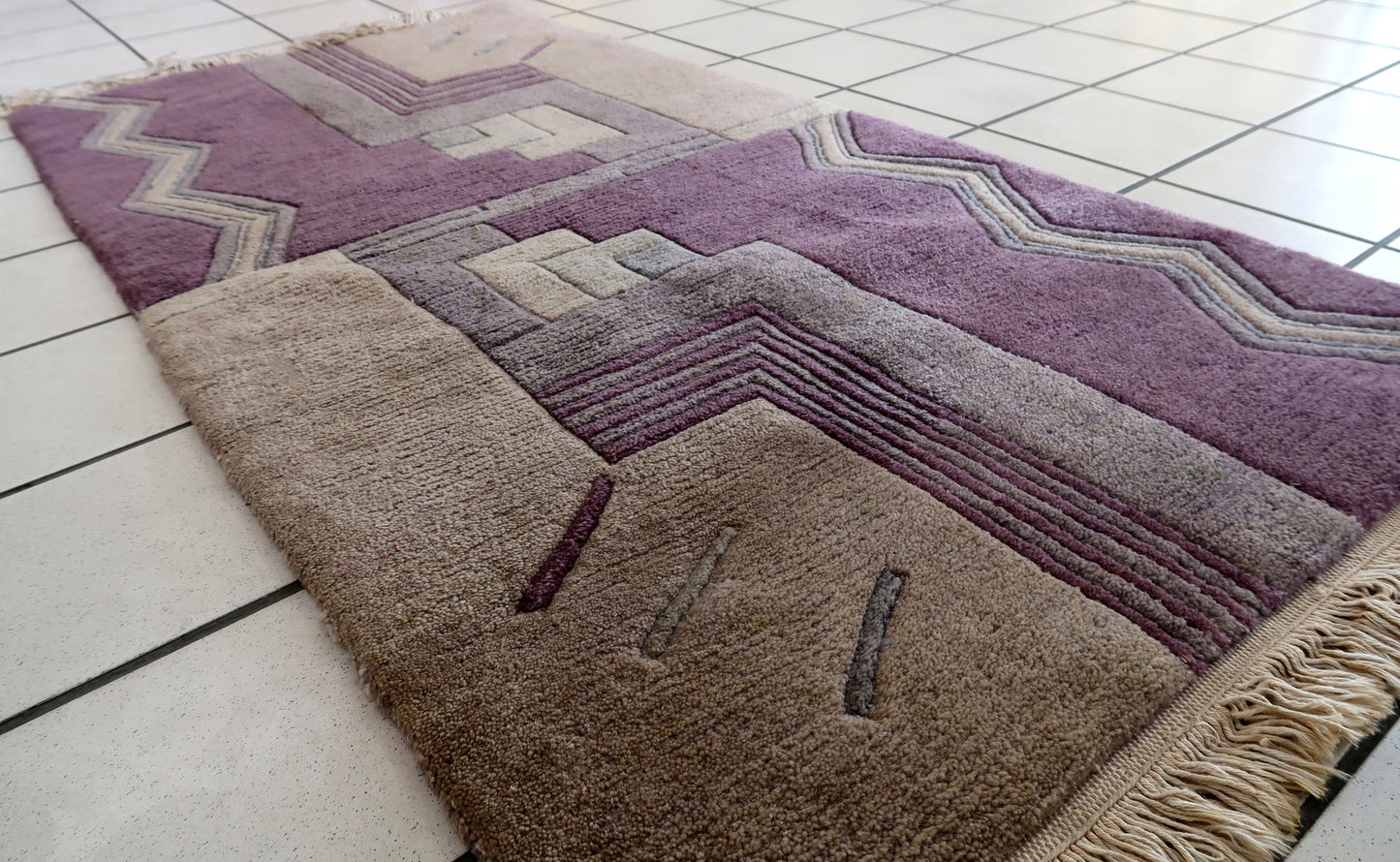 Handmade vintage Tibetan Khaden rug in geometric design. The rug has been made in wool in the end of 20th century. It is in original good condition.