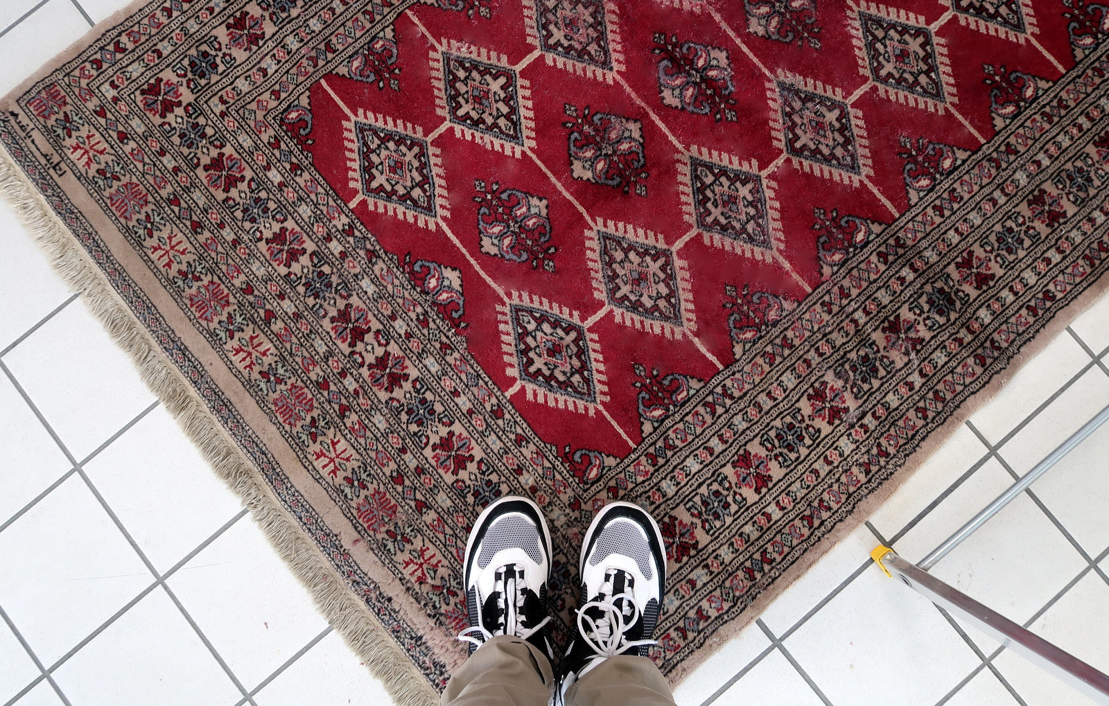 Handmade vintage Uzbek Bukhara rug in red color. The rug has been made in wool in the end of 20th century. It is in original condition, it has some signs of age.