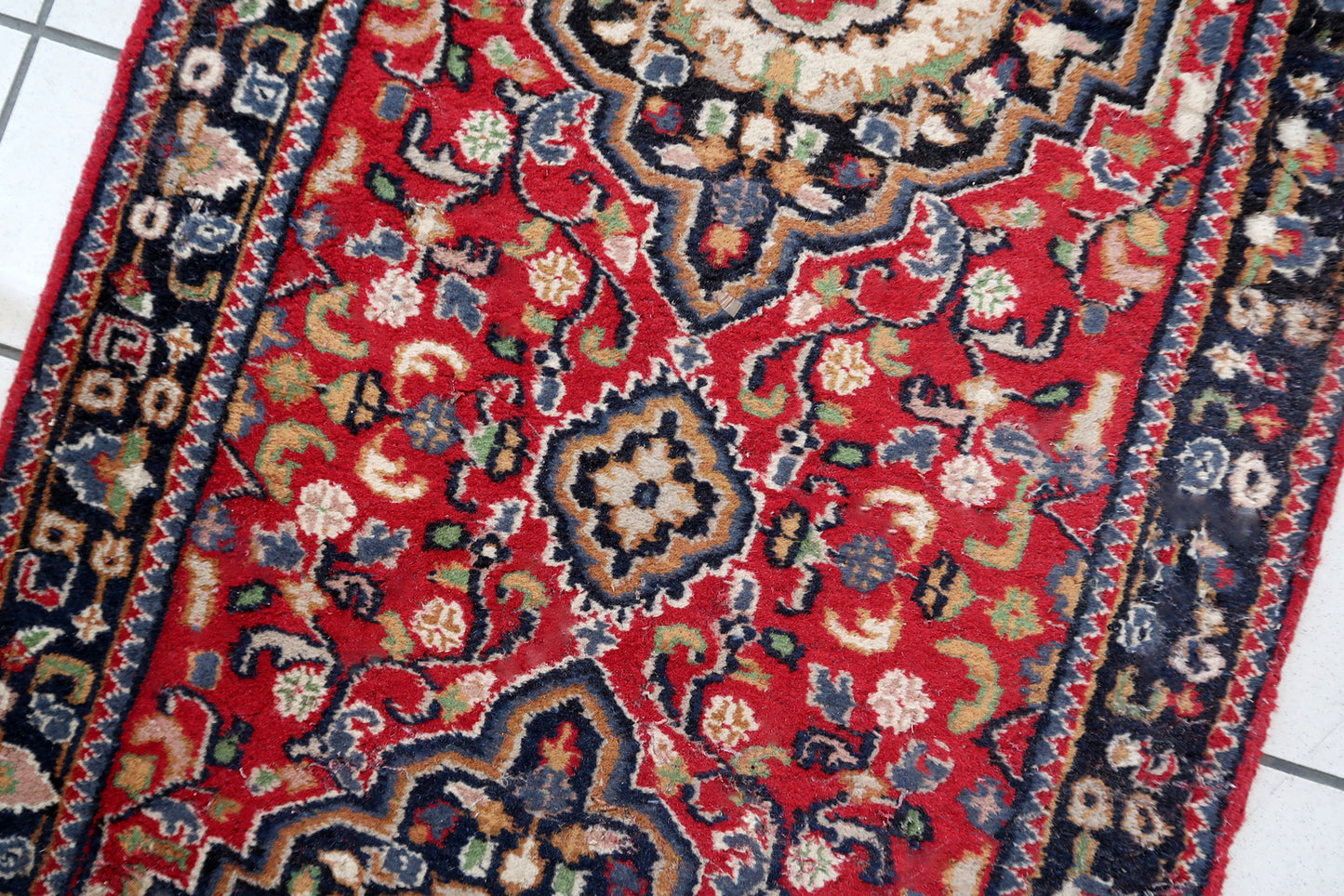 Handmade vintage Persian Malayer runner in red color. The rug has been made in wool in the middle of 20th century. It is in original condition, it has some signs of age.