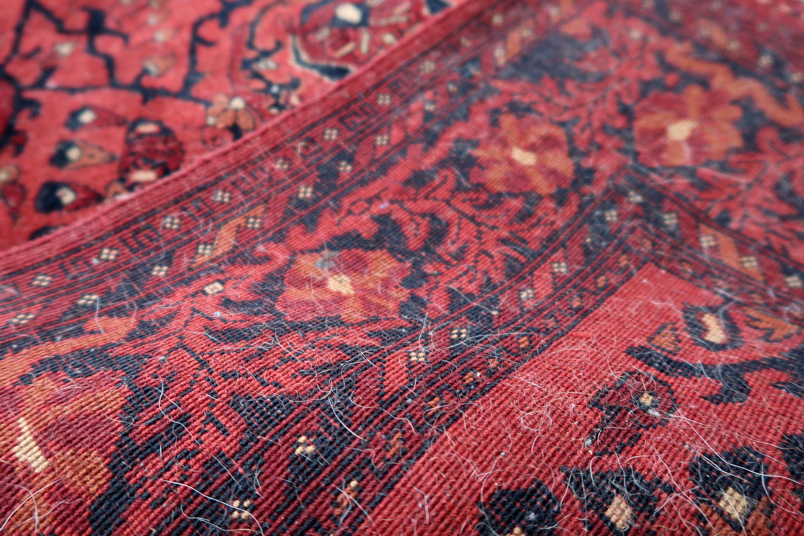 Handmade vintage Afghan Ersari runner in red color. The rug has been made in wool in the end of 20th century. It is in original good condition.