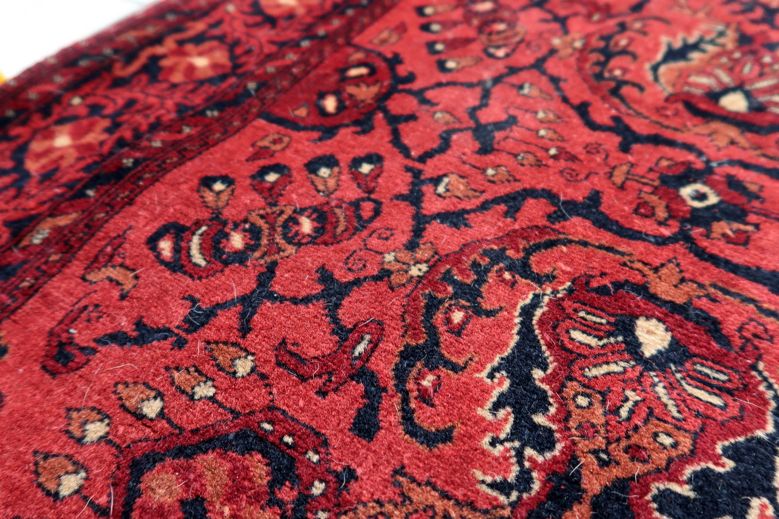 Handmade vintage Afghan Ersari runner in red color. The rug has been made in wool in the end of 20th century. It is in original good condition.