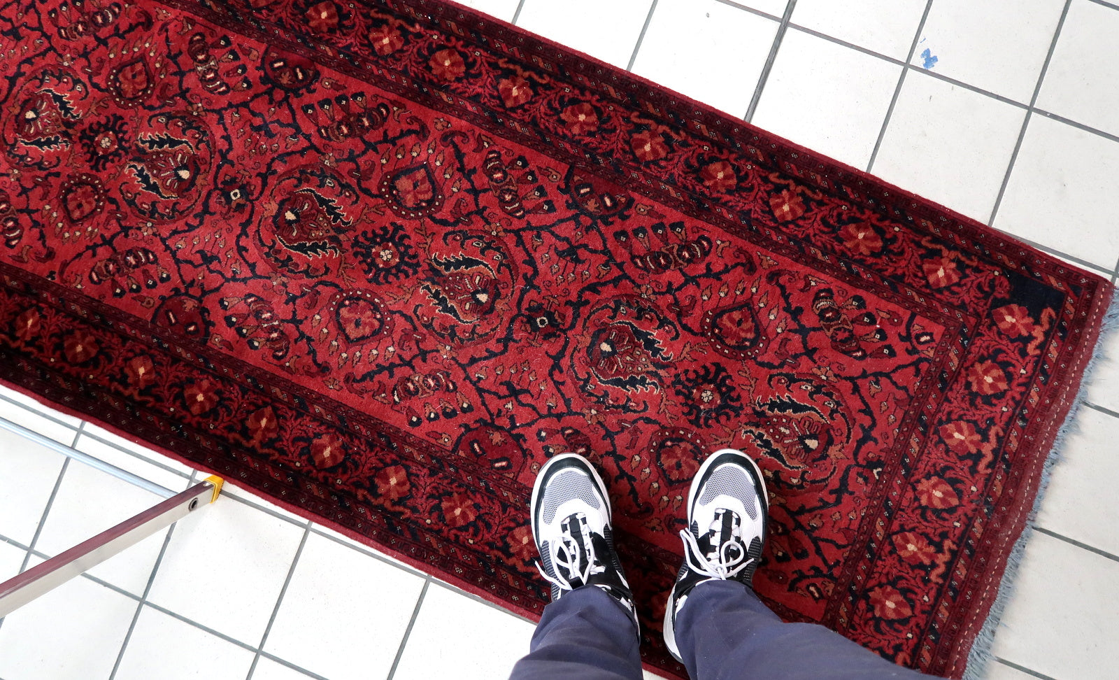 Handmade vintage Afghan Ersari runner in red color. The rug has been made in wool in the end of 20th century. It is in original good condition.