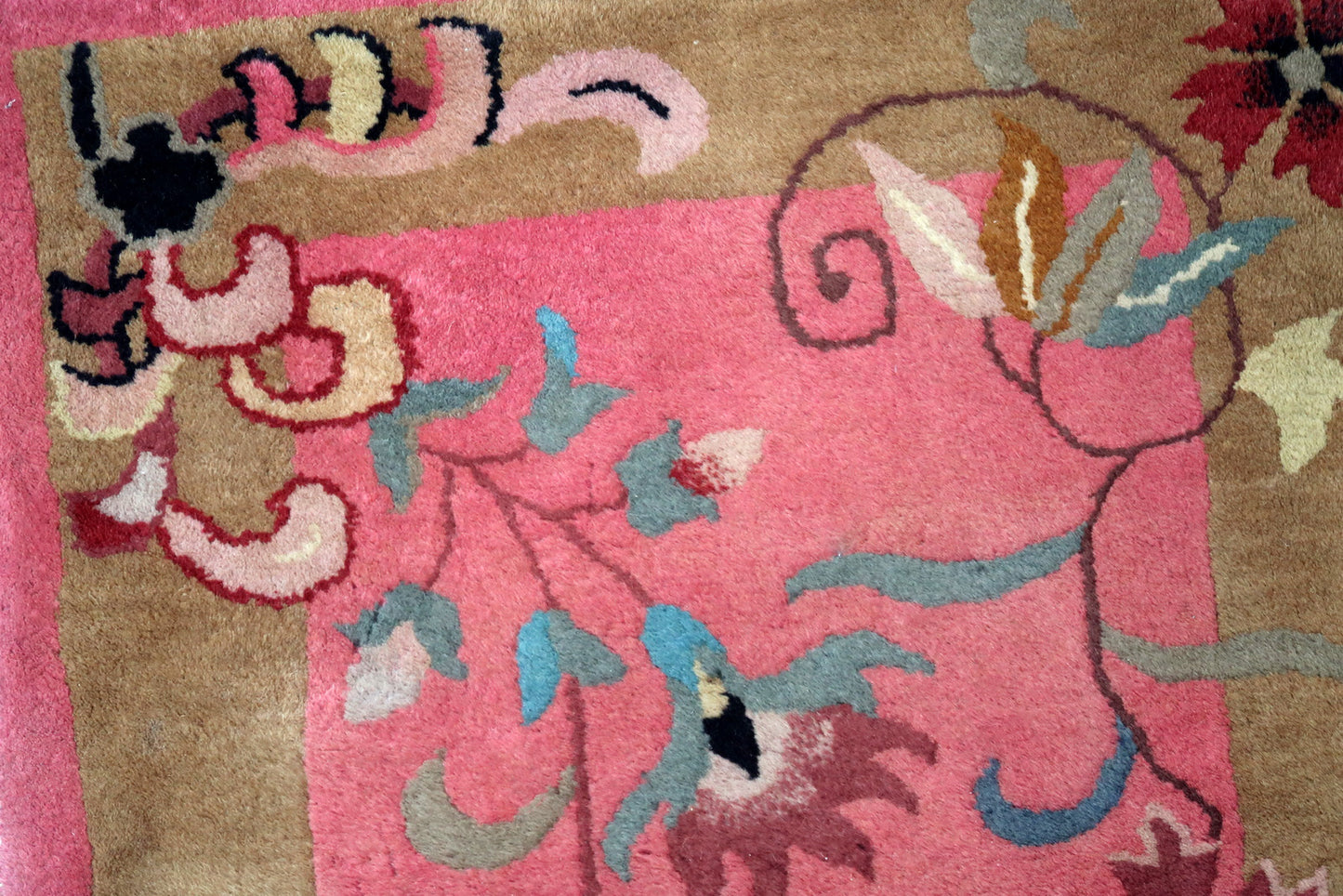 Handmade antique Art Deco Chinese rug in good condition. The rug has been made in China in fuchsia shade. The rug is from the beginning of 20th century.