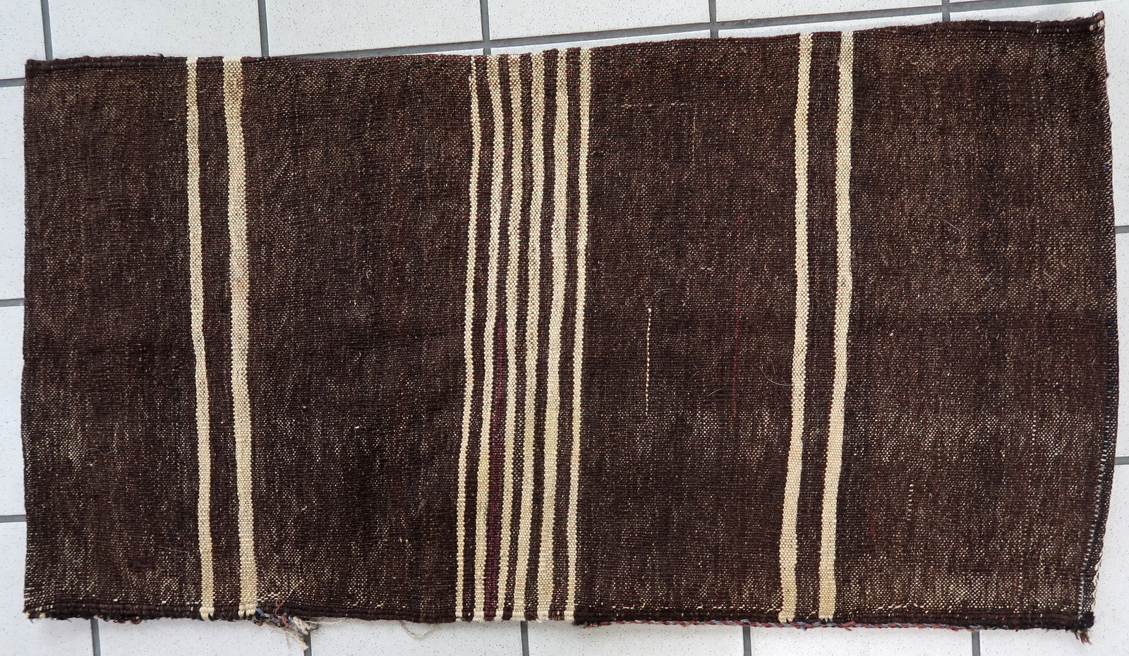 Handmade antique Afghan Baluch saddle bag in original condition, it has some age wear. The bag has been made in the beginning of the 20th century in original combination of colors.