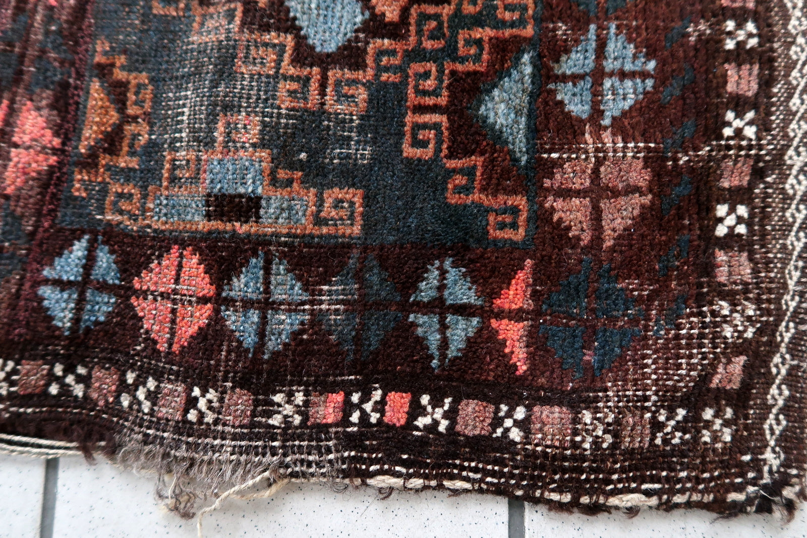 Handmade antique Afghan Baluch saddle bag in original condition, it has some age wear. The bag has been made in the beginning of the 20th century in original combination of colors.