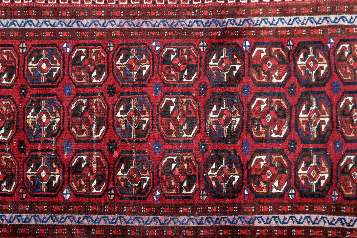 Handmade antique Afghan Ersari rug in traditional design. The rug is in from the beginning of 20th century in original condition, it has some signs of age.