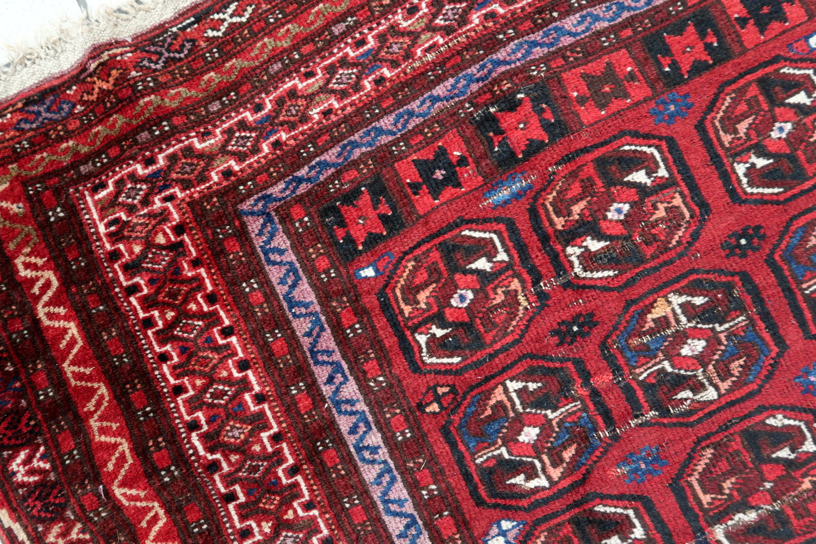 Handmade antique Afghan Ersari rug in traditional design. The rug is in from the beginning of 20th century in original condition, it has some signs of age.