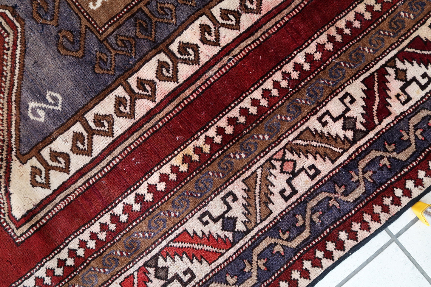 Handmade vintage Caucasian Kazak rug deep red color and large medallion. The rug is from the beginning of 20th century, it is in good condition. 