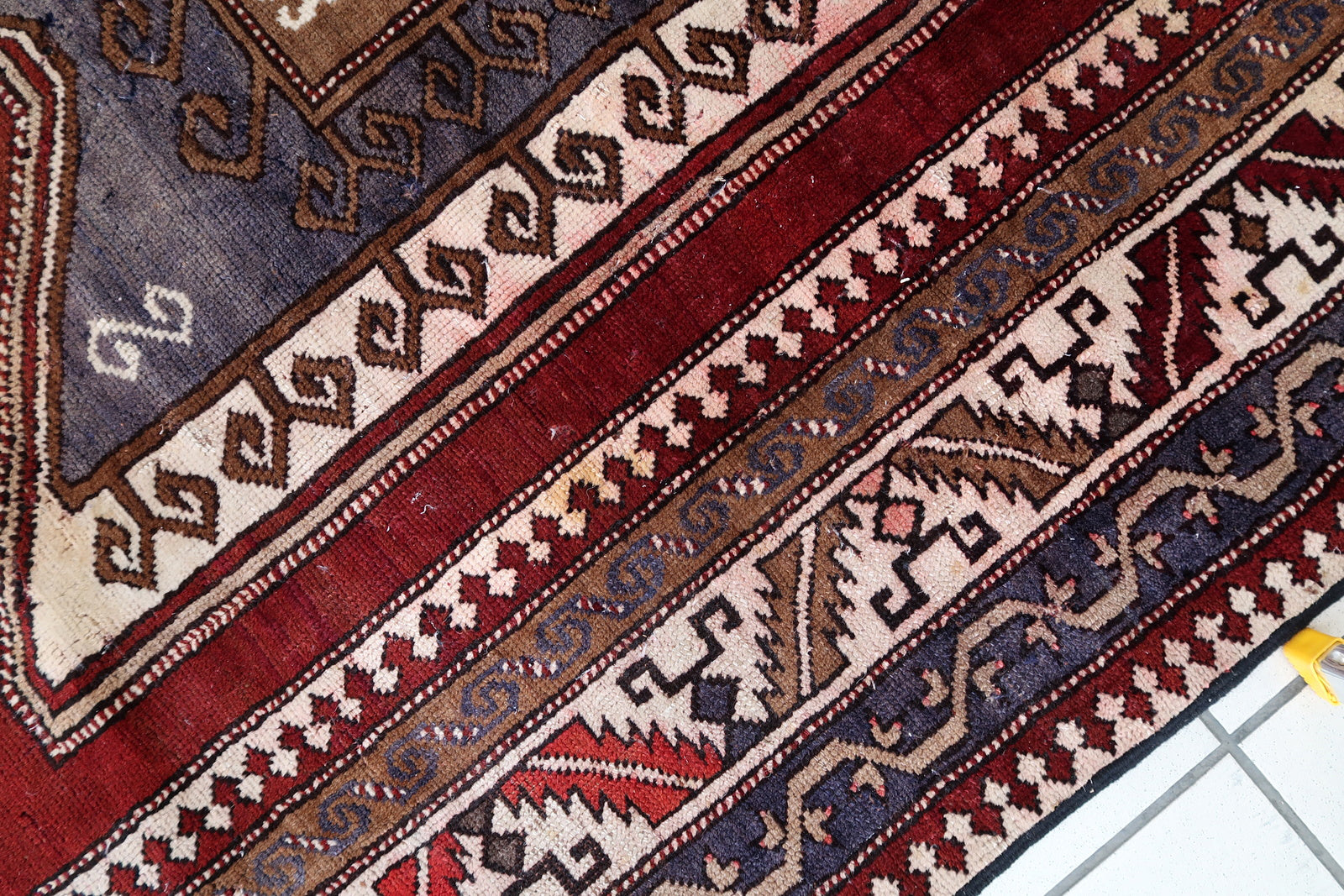 Handmade vintage Caucasian Kazak rug deep red color and large medallion. The rug is from the beginning of 20th century, it is in good condition. 