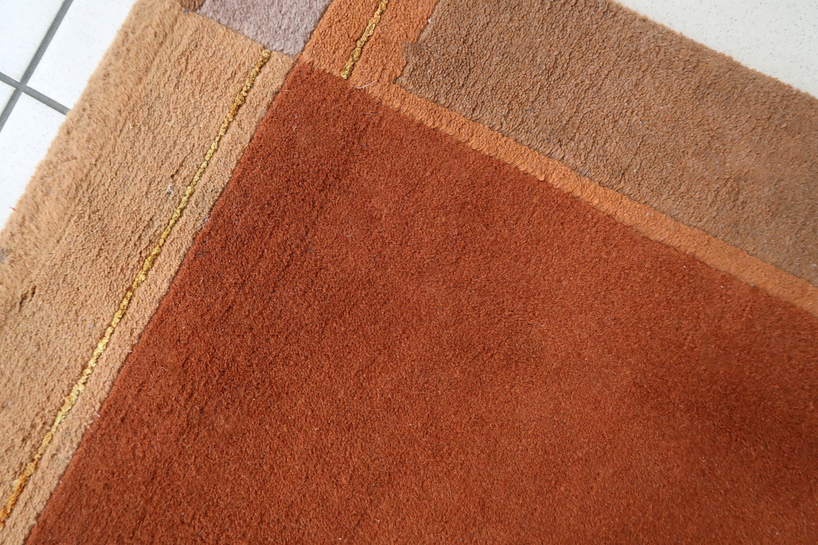 Handmade vintage Tibetan Khaden rug in different shades of brown and beige colors. The rug is from the end of 20th century, it is in original good condition. 
