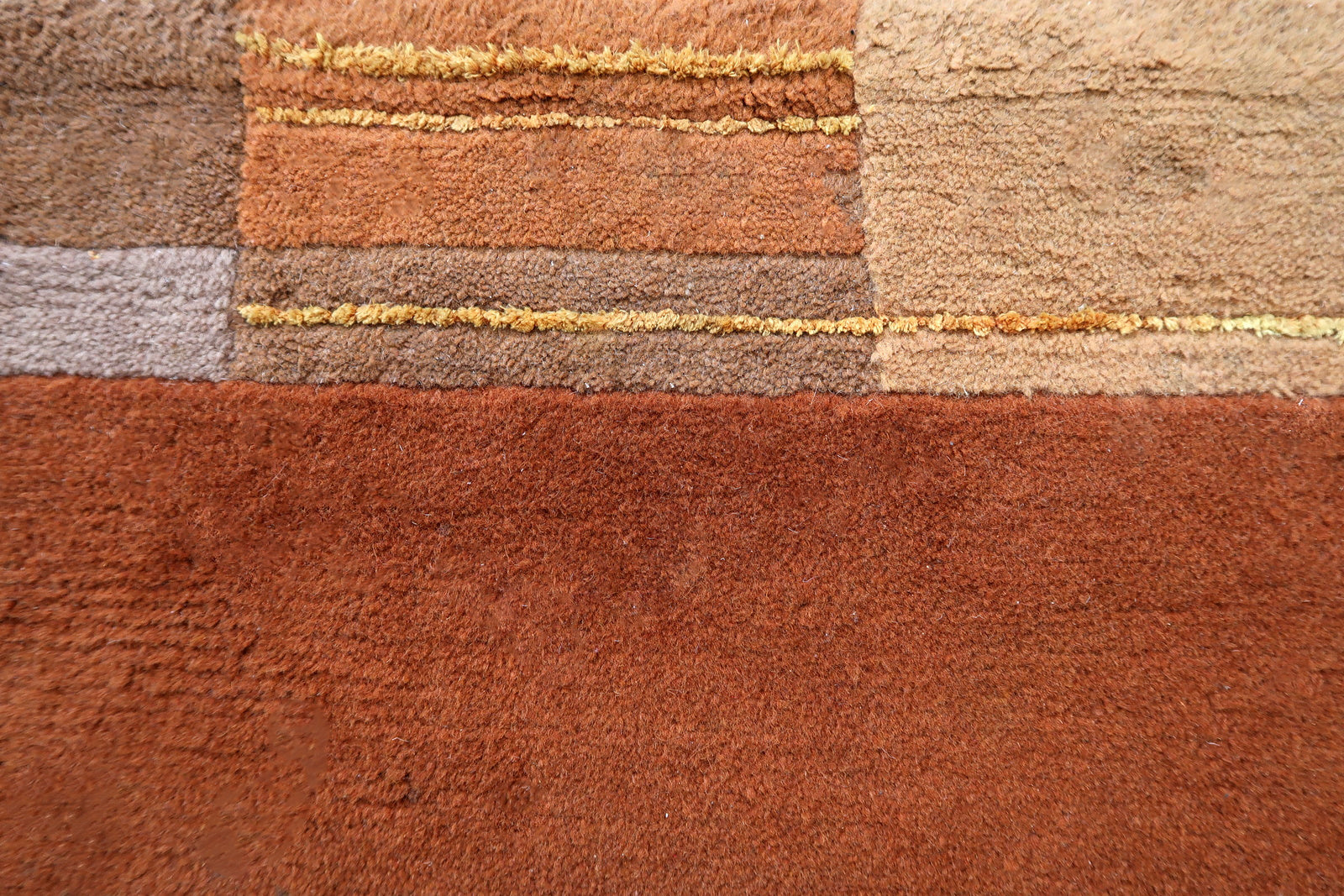 Handmade vintage Tibetan Khaden rug in different shades of brown and beige colors. The rug is from the end of 20th century, it is in original good condition. 