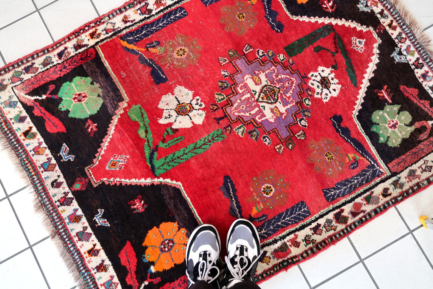 Handmade vintage Persian Gashkai rug in unusual design and bright red and chocolate brown color. The rug is from the end of 20th century, it is in original condition, has some low pile. 