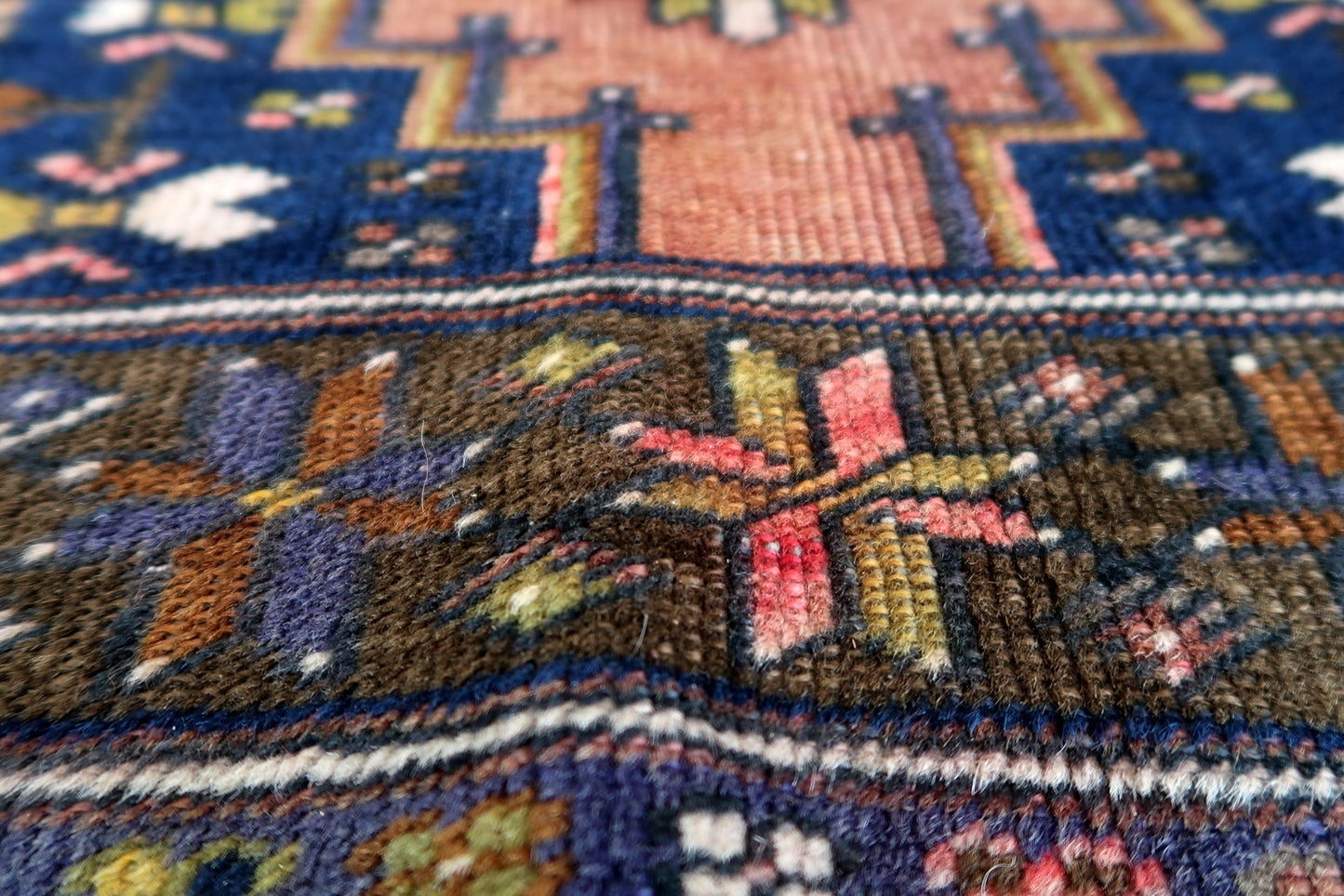 Handmade vintage Afghan Baluch rug in pink and olive colors. The rug is from the beginning of 20th century, it is in original good condition.