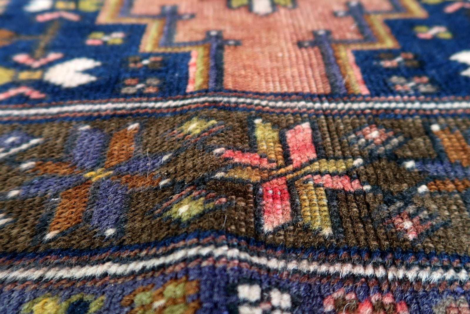 Handmade vintage Afghan Baluch rug in pink and olive colors. The rug is from the beginning of 20th century, it is in original good condition.
