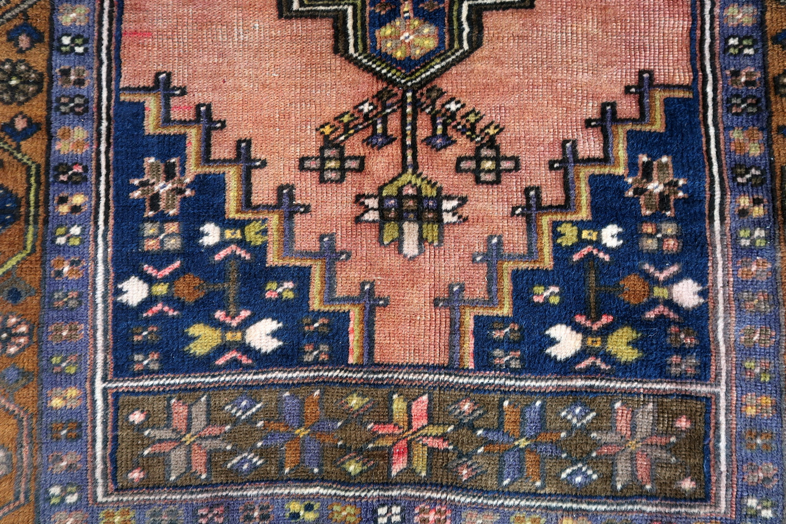 Handmade vintage Afghan Baluch rug in pink and olive colors. The rug is from the beginning of 20th century, it is in original good condition.