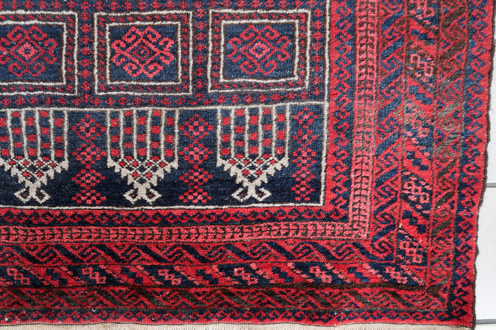 Handmade vintage Afghan Baluch rug in red and night blue colors. The rug is from the beginning of 20th century, it is in original good condition. This rug is prayer.