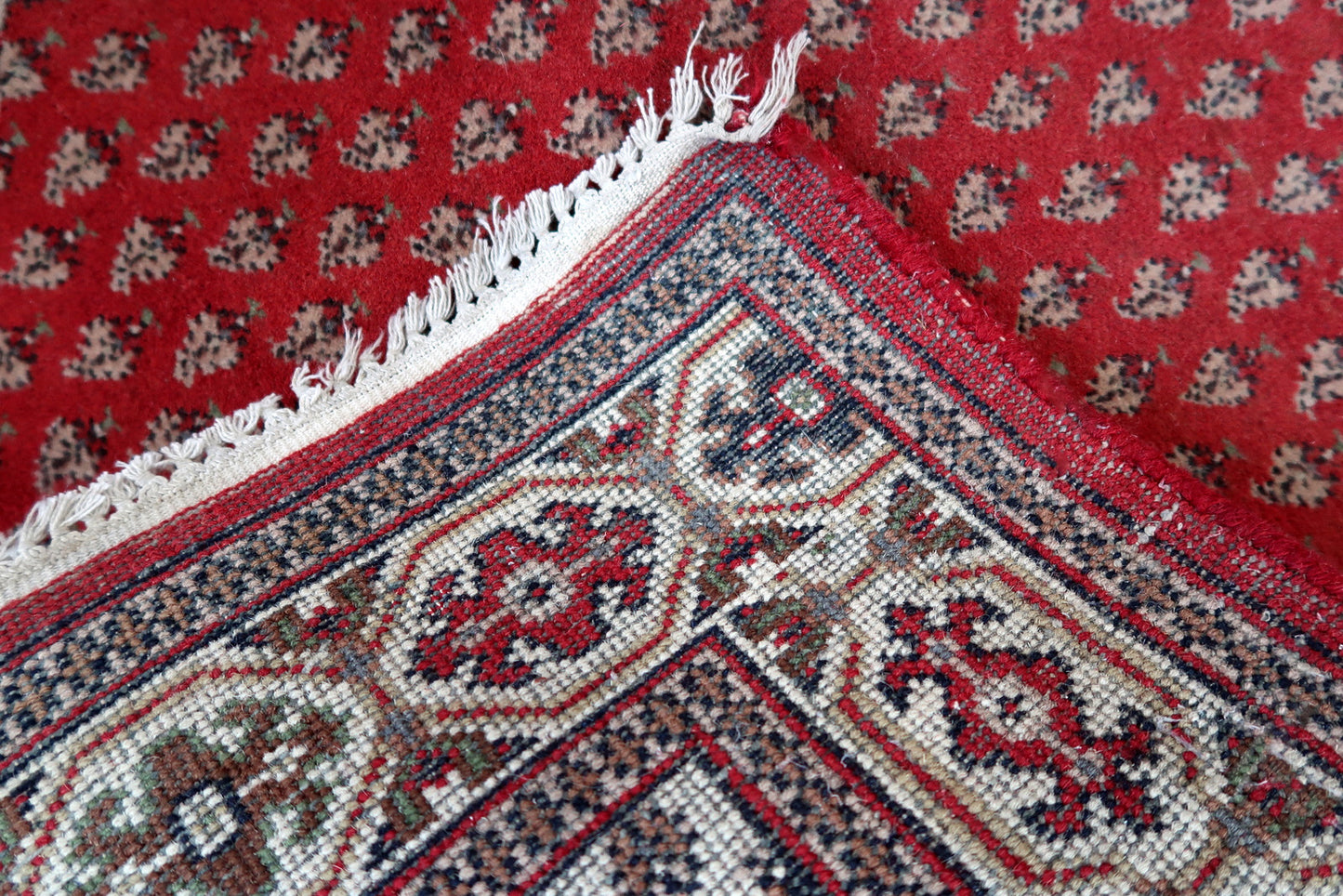 Handmade vintage Indian Seraband rug in red color and all-over design. The rug has been made in the end of 20th century. It is in original good condition.